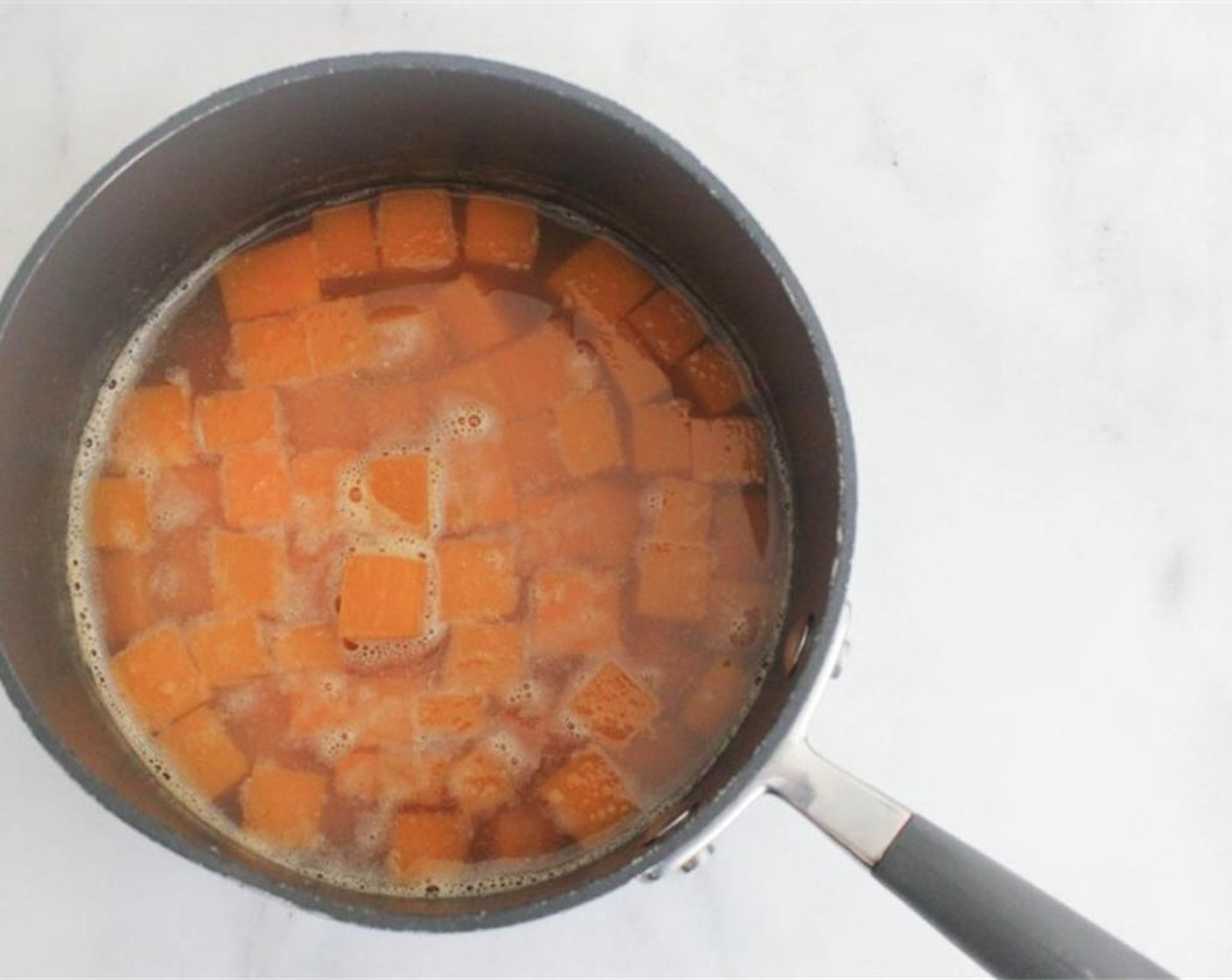 step 2 Place cubed Butternut Squash (4 cups) in a medium pot. Add Low-Sodium Chicken Broth (3 cups). Bring to a boil then lower to a simmer. Cook for 20-25 minutes until tender.