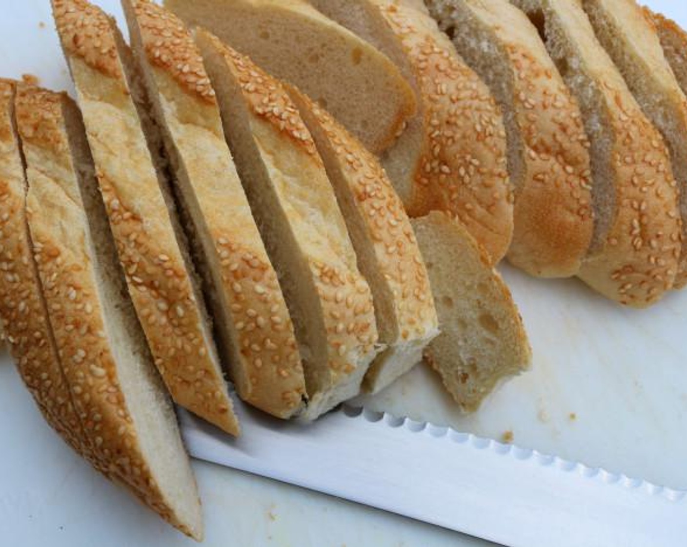 step 6 While the soup simmers, slice enough Baguette (1), enough to cover the surface of the pot or individual oven-proof bowls.