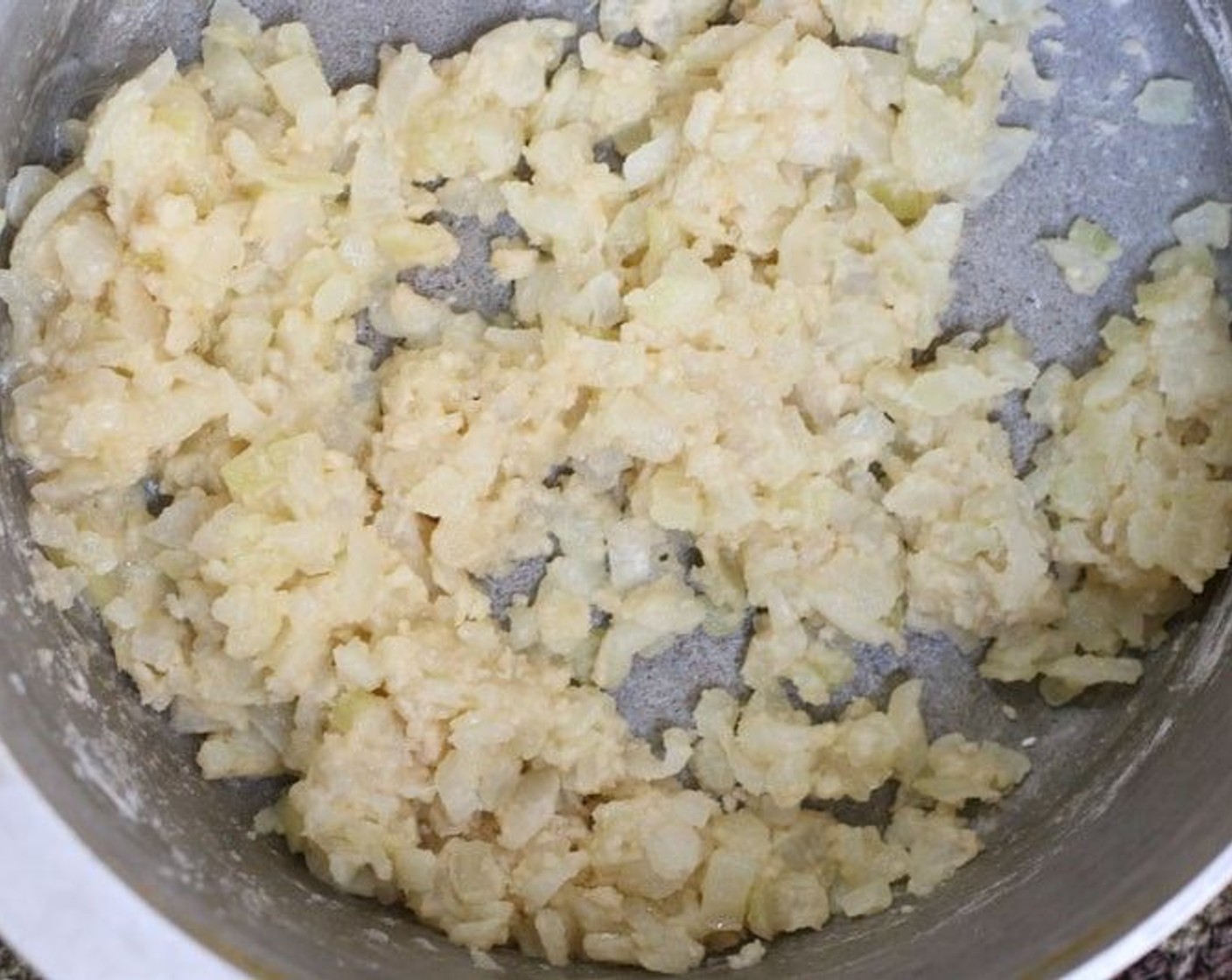 step 7 Sprinkle with All-Purpose Flour (1/3 cup) and stir until you have a barely light brown roux (closer to blonde).