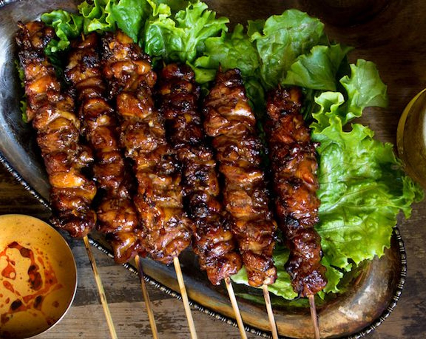 step 15 Serve over a bed of green lettuce with the peanut sauce. Enjoy!