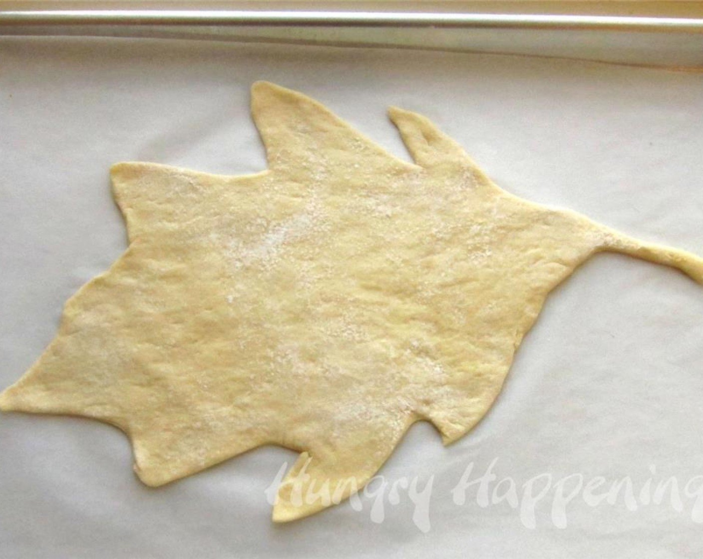 step 3 Carefully move the dough leaf to a parchment paper lined baking sheet.