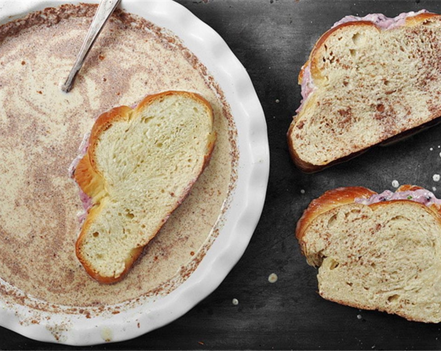 step 5 Dip the stuffed challah into the milk/cream mixture turning every so often to allow the bread to soak up the liquid. Since the slices are pretty thick, make sure they soak up enough liquid.