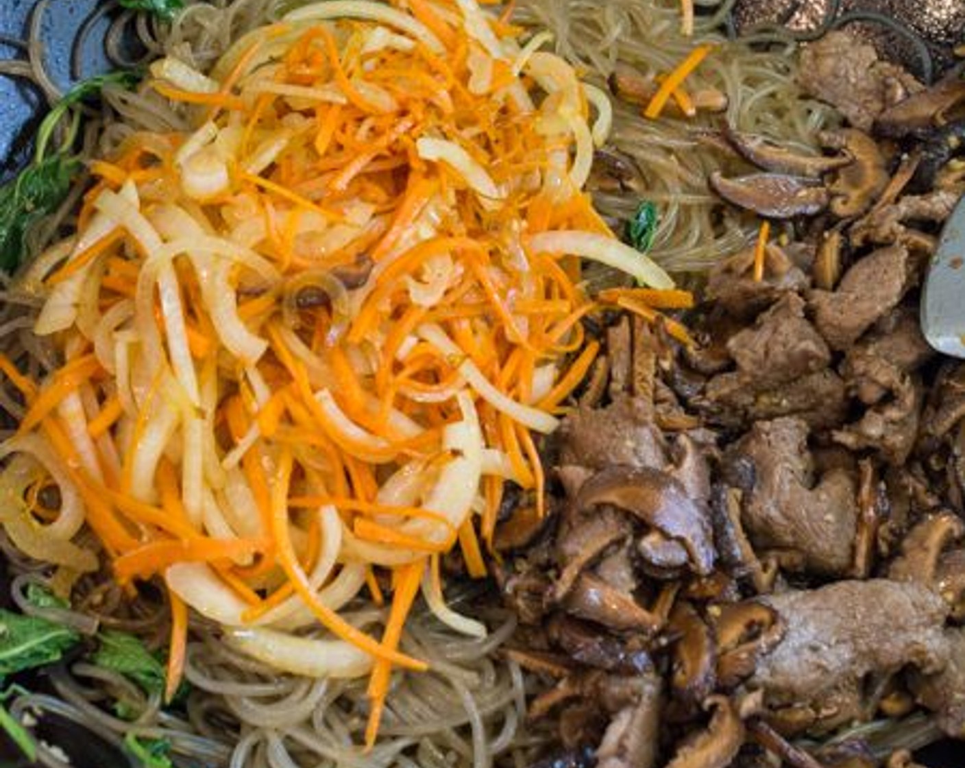 step 10 Add the beef, mushrooms, Carrot (1), Onion (1), and Toasted White Sesame Seeds (1 Tbsp). Toss to combine all ingredients.