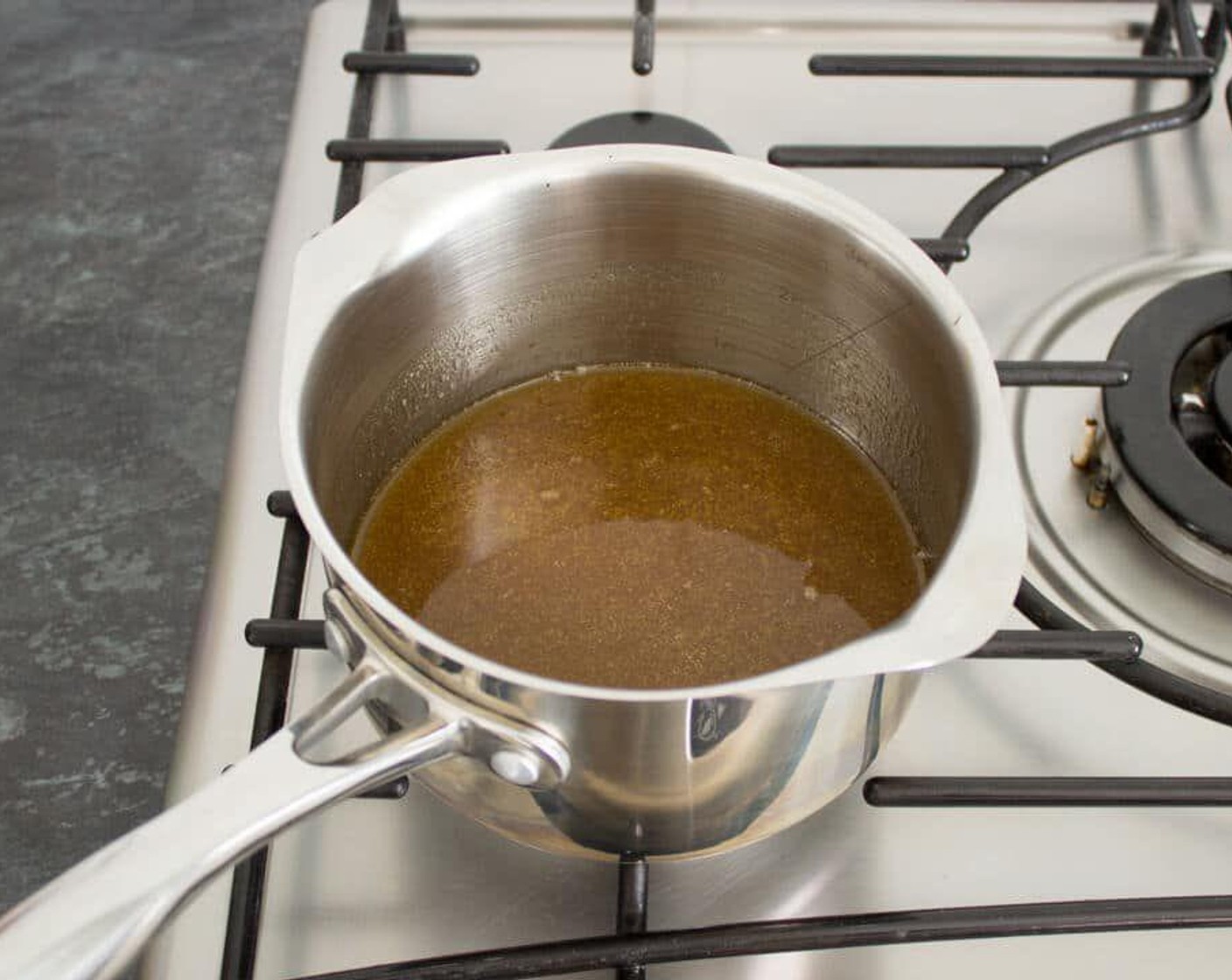 step 4 In a medium saucepan, gently melt together the Brown Sugar (1/2 cup), Unsalted Butter (1/2 cup), and Golden Syrup (1/4 cup) over a medium heat. Stir until the sugar is dissolved, then remove from the heat.