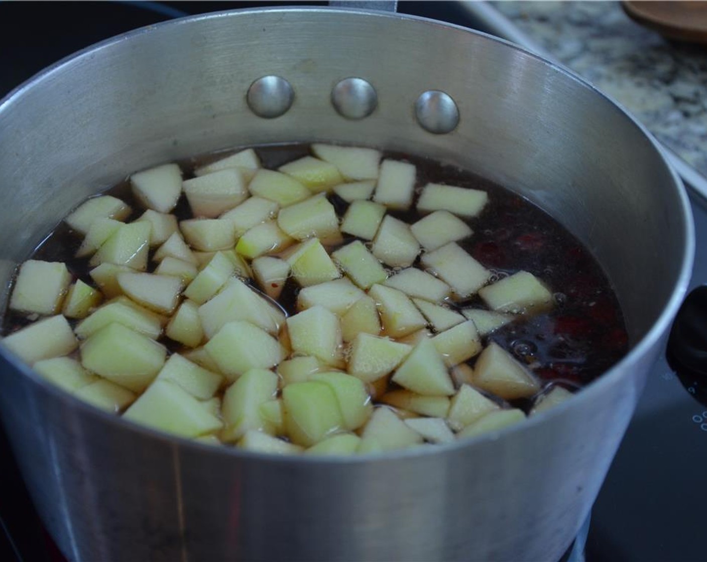 step 3 Reduce the liquid to half. While reducing, dice the Shallot (1/2 cup) and zest the Lemon (1).