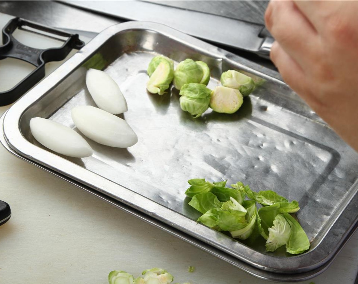 step 23 Remove outer level of sprout leaves and set aside, removing any that are excessively discolored.