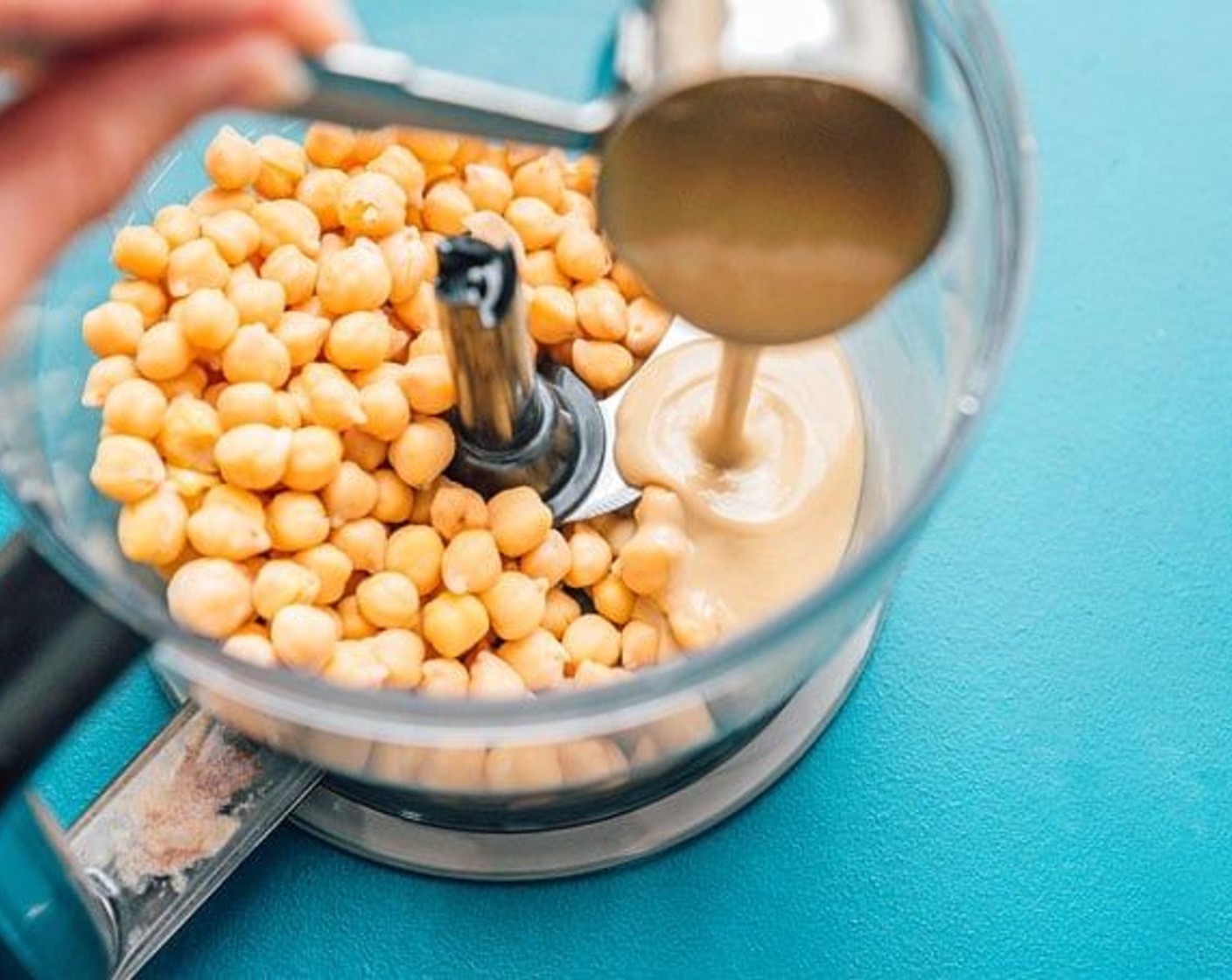 step 1 In a food processor, combine Chickpeas (1 can), Tahini (1/4 cup) and Vanilla Extract (1 tsp) until smooth. Add Water (2 Tbsp) to thin a little bit.