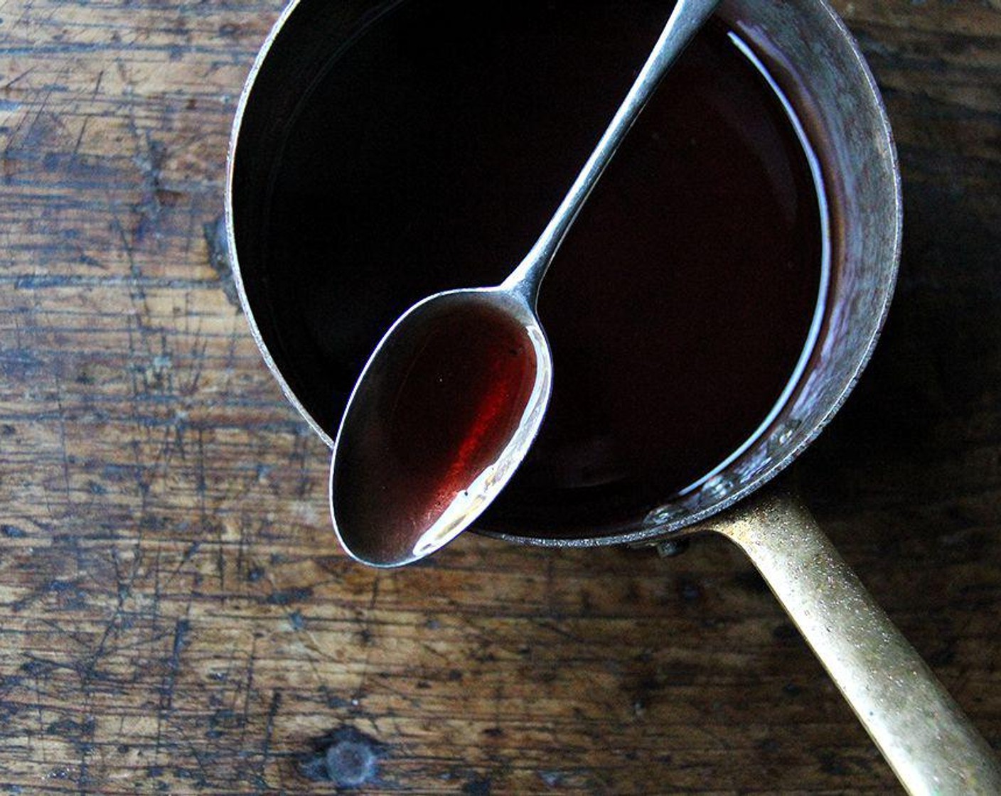 step 2 Add the Banyuls Fortified Wine (1/4 cup) and Star Anise (1 piece) if using. Simmer until the liquid reduces to thin syrup, about 10 minutes. Keep the gastrique warm over very low heat until ready to use.