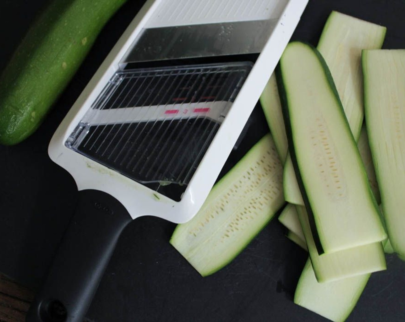 step 8 If you have a spiralizer (you’re so fancy!), use that to turn your Zucchini (2) into pasta. If you don’t have a spiralizer, no worries, I don’t either. Use a mandolin or a knife to slice each zucchini into planks about an 1/8-inch thick.