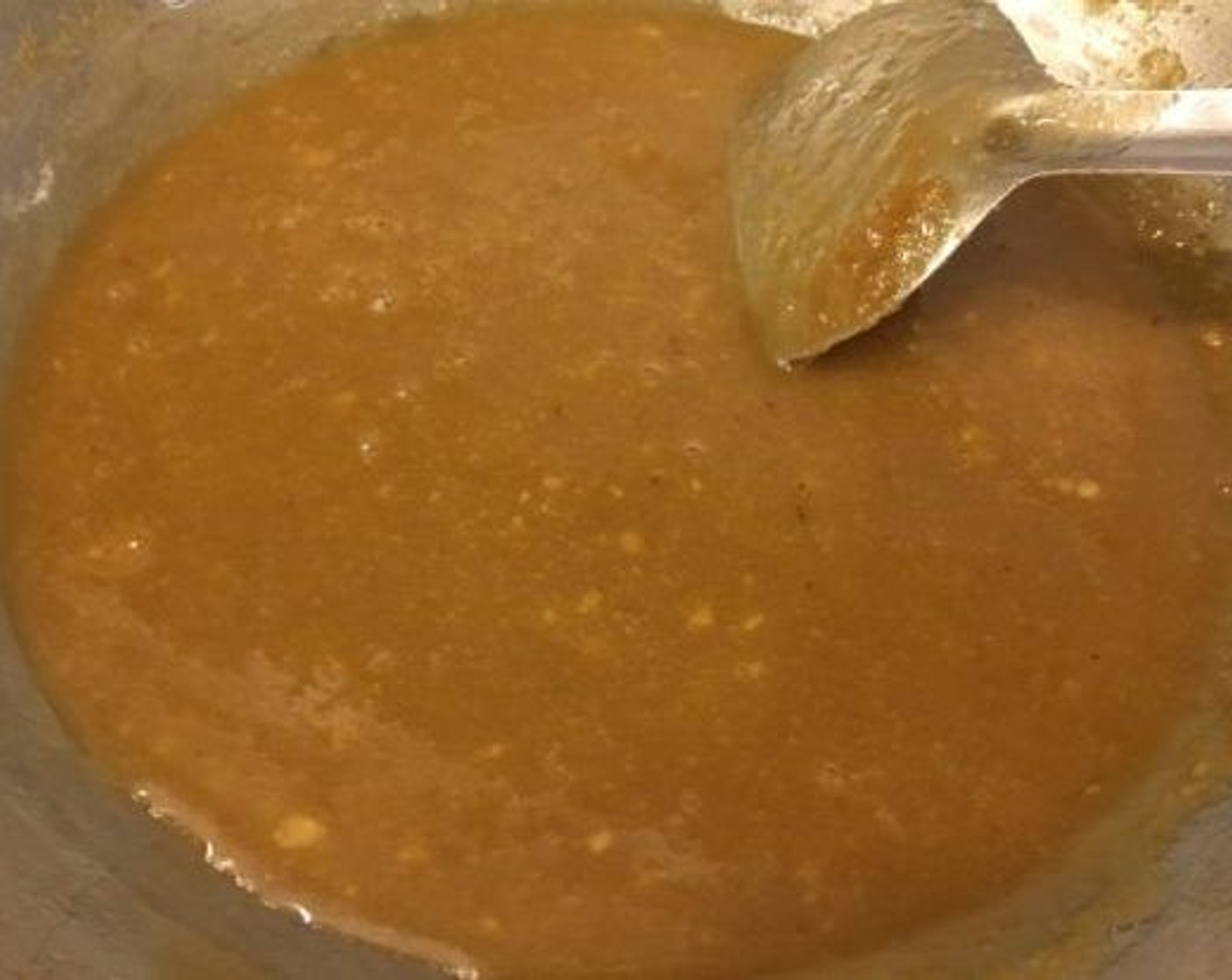 step 3 At this point add Khoya Barfi (1 1/2 cups) and mix rigorously. There should not be any lumps. Mixing it into the sugar syrup will make sugar syrup thin that’s why we need the sugar syrup to be a really thick consistency.