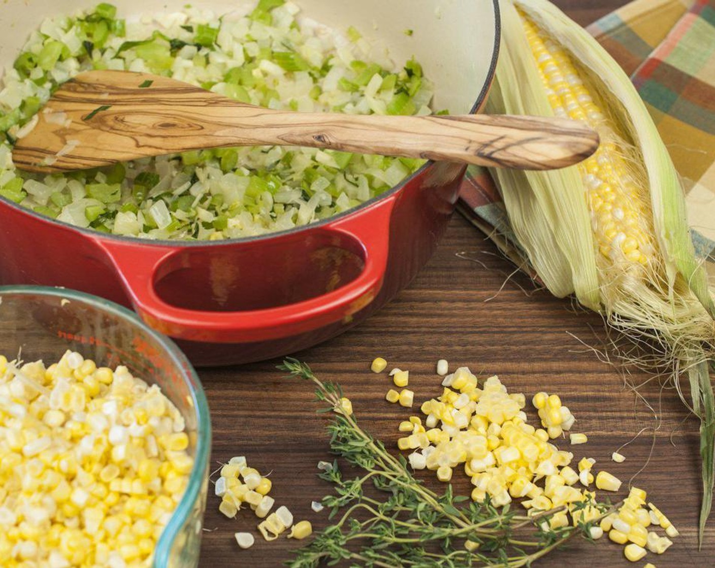 step 2 While vegetables are cooking prepare Corn Kernels (4 cups) by peeling off corn husks and removing silk. Stand corn on end and remove kernels by running a large knife along the body, cutting at the base of the kernels. Trim ends off bare cobs and cut the cob in half. Add kernels and cobs to pot along with Vegetable Broth (2 cups), Water (2 cups), Fresh Thyme (to taste), and Salt (1/2 tsp).