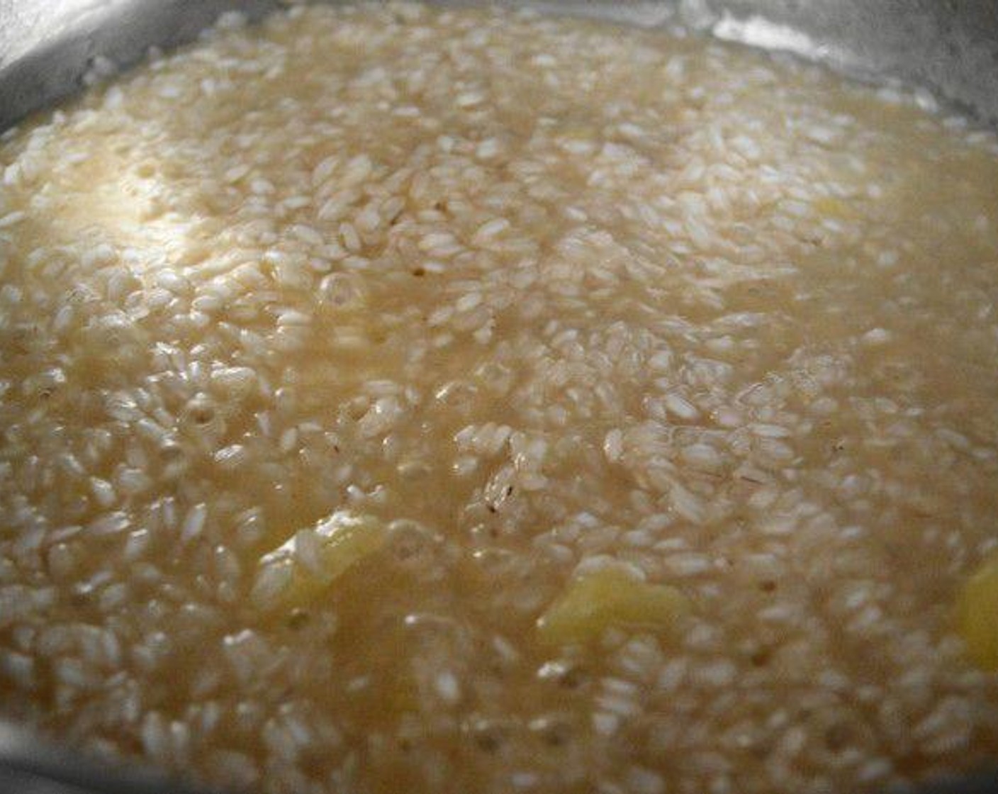 step 3 Pour the Pineapple Juice (1/2 cup) into the pan and let it completely get absorbed by the rice, about 2-3 minutes. While that happens add in the Salt (1 pinch) and Ground Cinnamon (1/4 tsp) for flavor. Also get a small pot on the stove with the Chicken Stock (2 3/4 cups) in it and just warm it up on low heat.