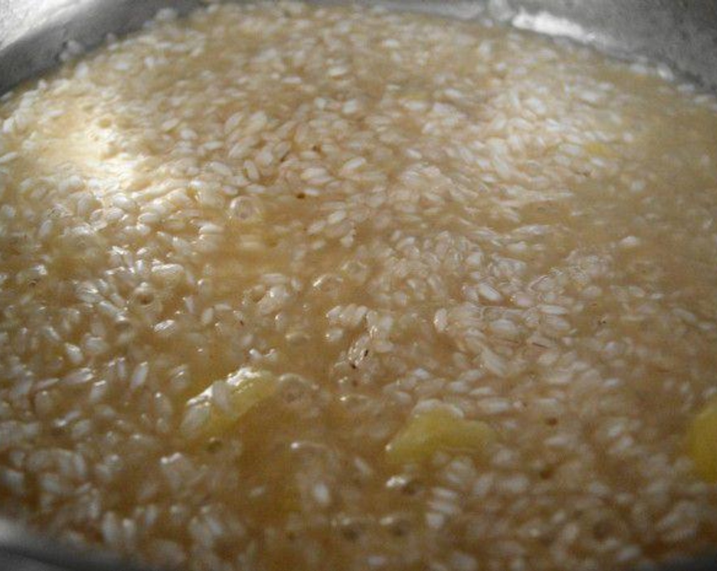 step 3 Pour the Pineapple Juice (1/2 cup) into the pan and let it completely get absorbed by the rice, about 2-3 minutes. While that happens add in the Salt (1 pinch) and Simply Organic Cinnamon, Ground (1/4 tsp) for flavor. Also get a small pot on the stove with the Chicken Stock (2 3/4 cups) in it and just warm it up on low heat.