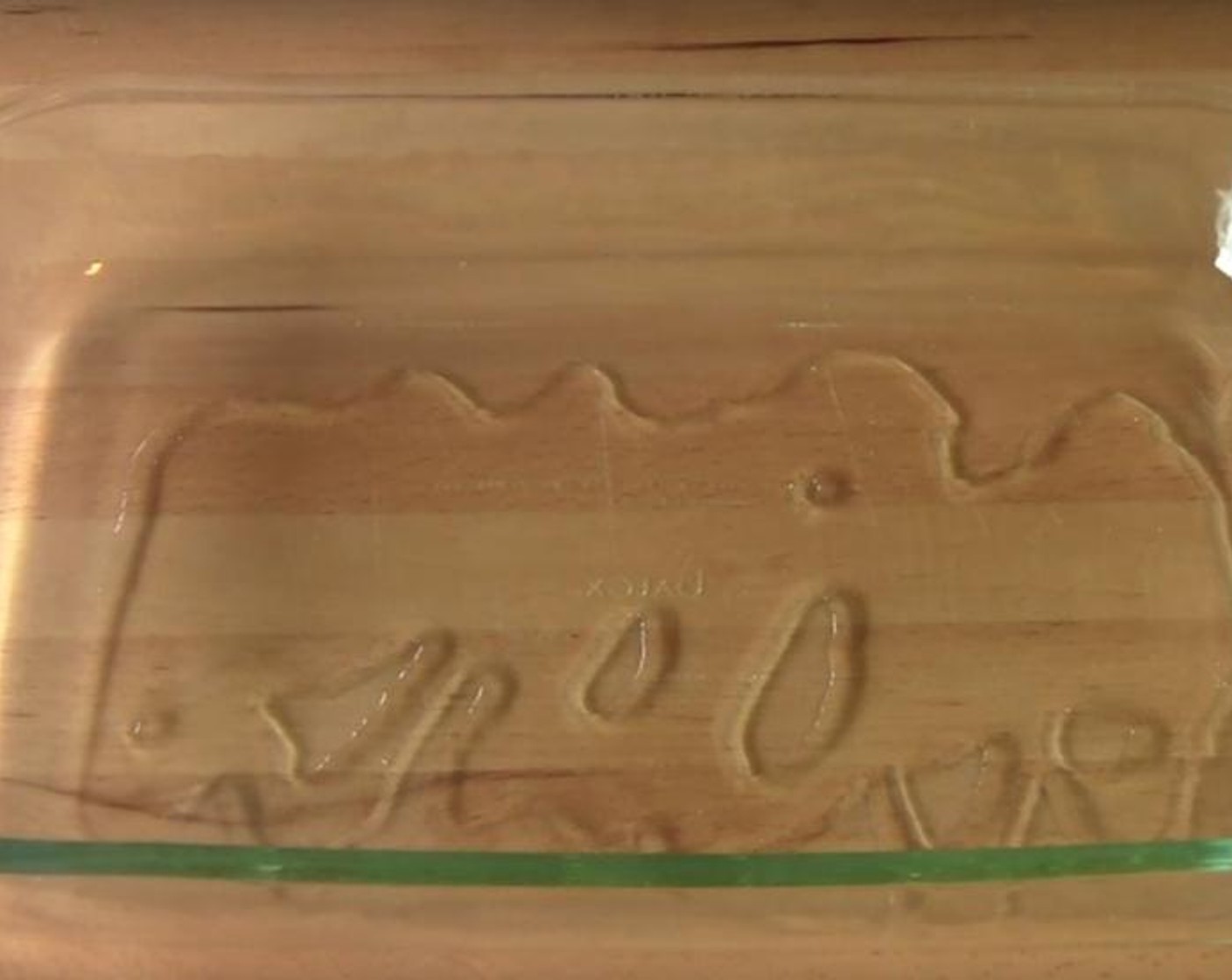 step 2 Put Olive Oil (2 Tbsp) into a large baking dish. Put it into an oven preheated to 200 degrees C (400 degrees F) for 5 minutes.