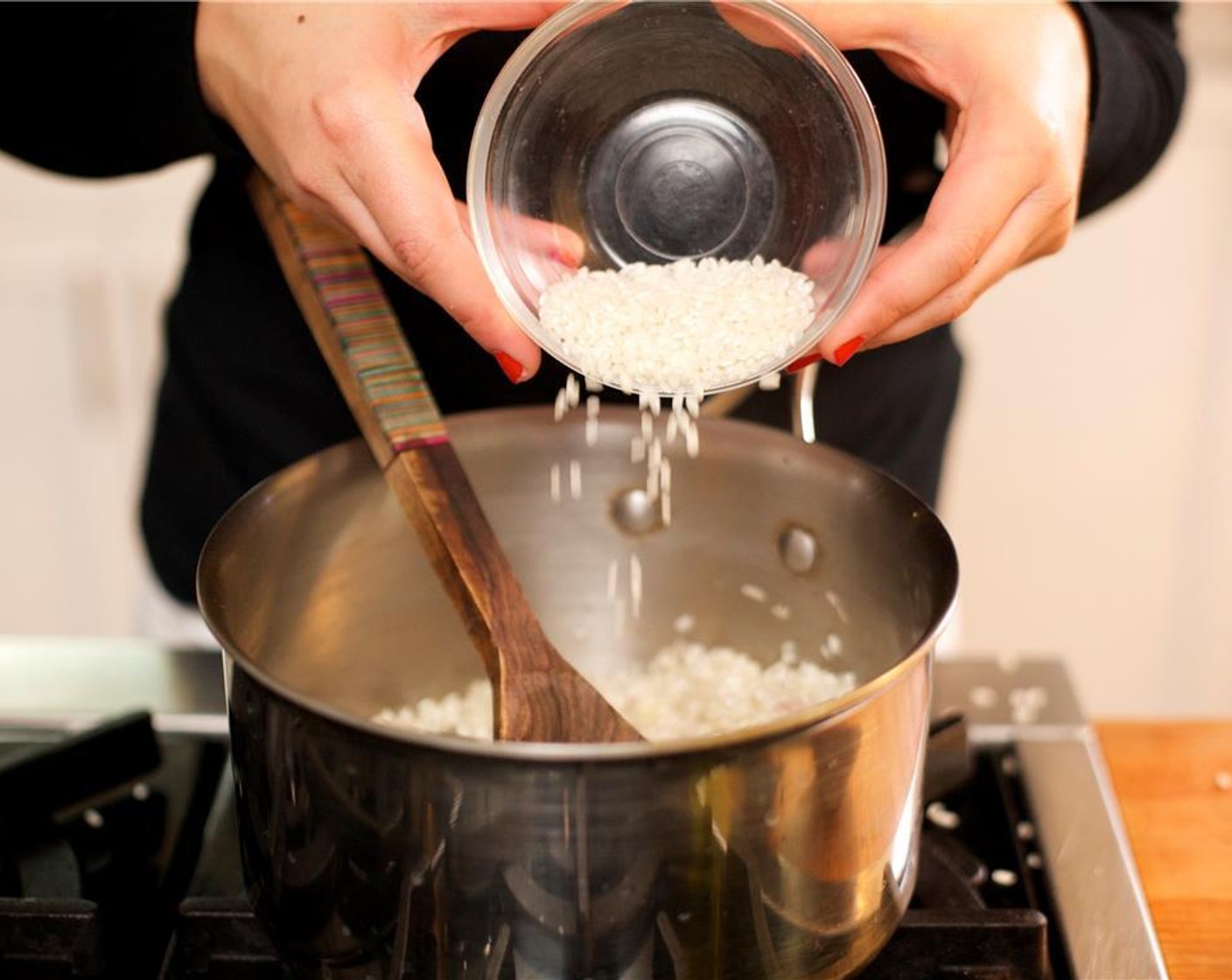 step 9 Add the Arborio Rice (1 cup) and saute for two minutes while stirring constantly.