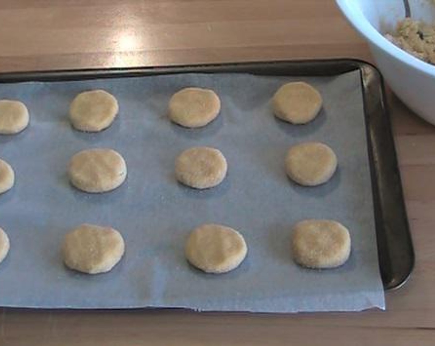 step 3 Make the dough into small round cookies. Roll each cookie dough on the Cinnamon Sugar (to taste), and place it on a baking tray lined with baking paper. Bake under 180 degrees C (350 degrees F) for about 8 minutes.