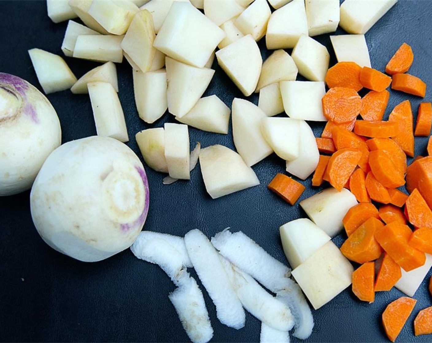 step 3 Add in Turnips (2), Carrots (3) and Potatoes (2) and bring to a boil.