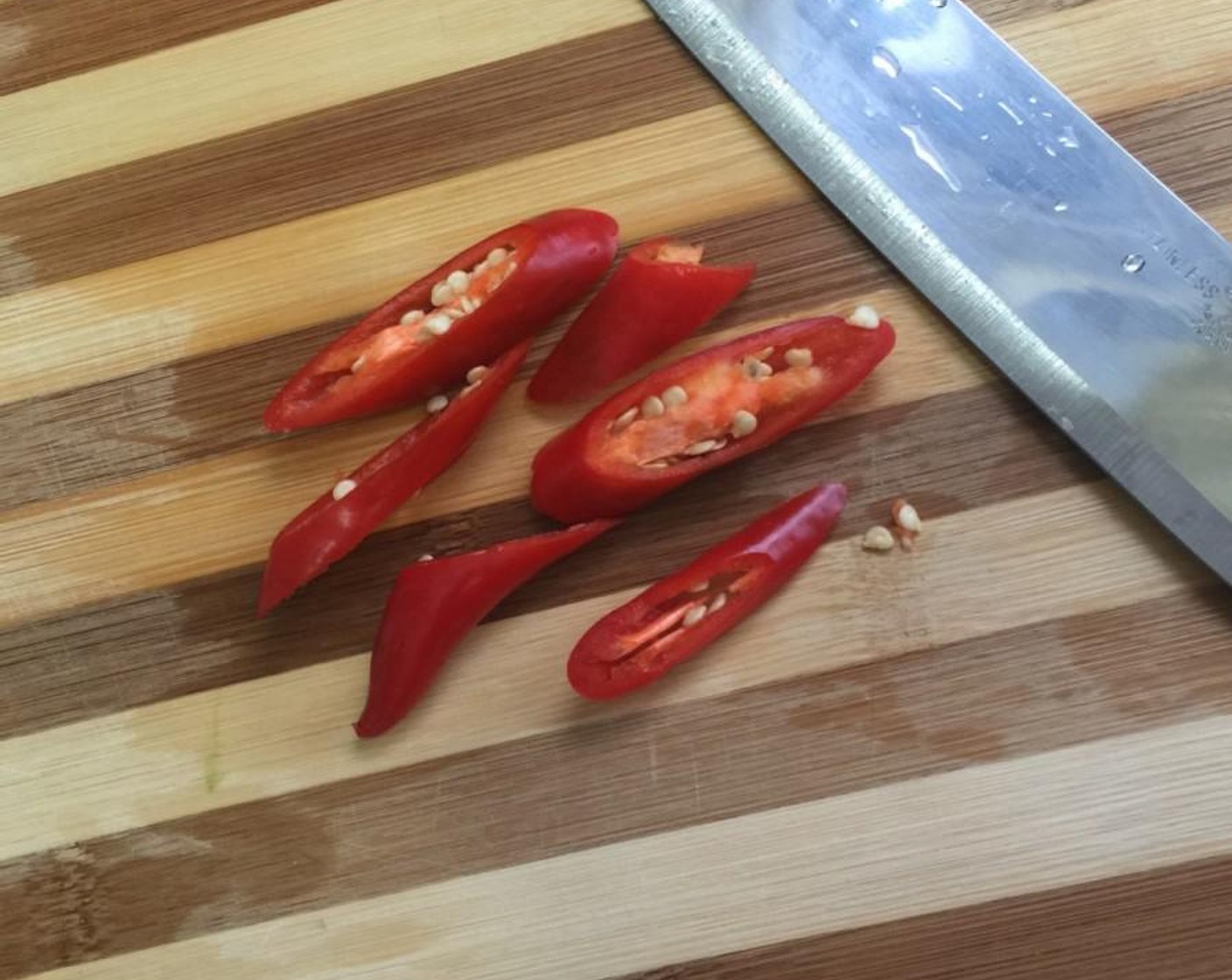 step 4 Next, cut a Red Chili Pepper (1) into thick slices and set aside while we prepare the seasonings.