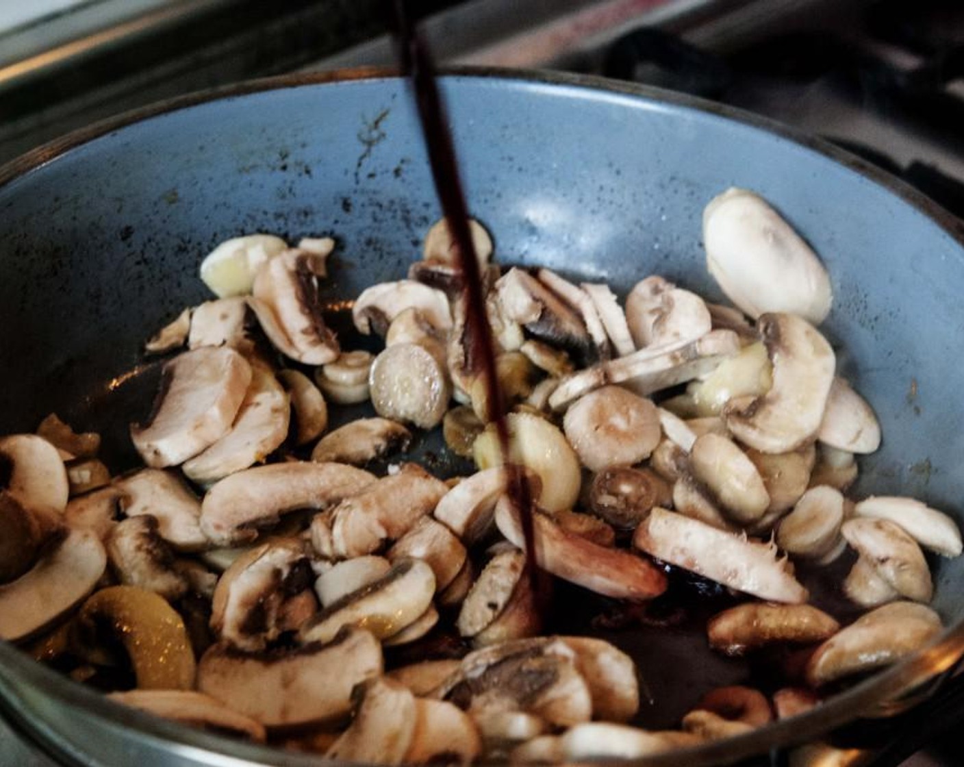 step 3 In a skillet heat up one of the Garlic (1 clove) and Extra-Virgin Olive Oil (2 Tbsp). Add the mushrooms and season with Salt (to taste) and Ground Black Pepper (to taste) and pour in the Red Wine (1/2 cup).