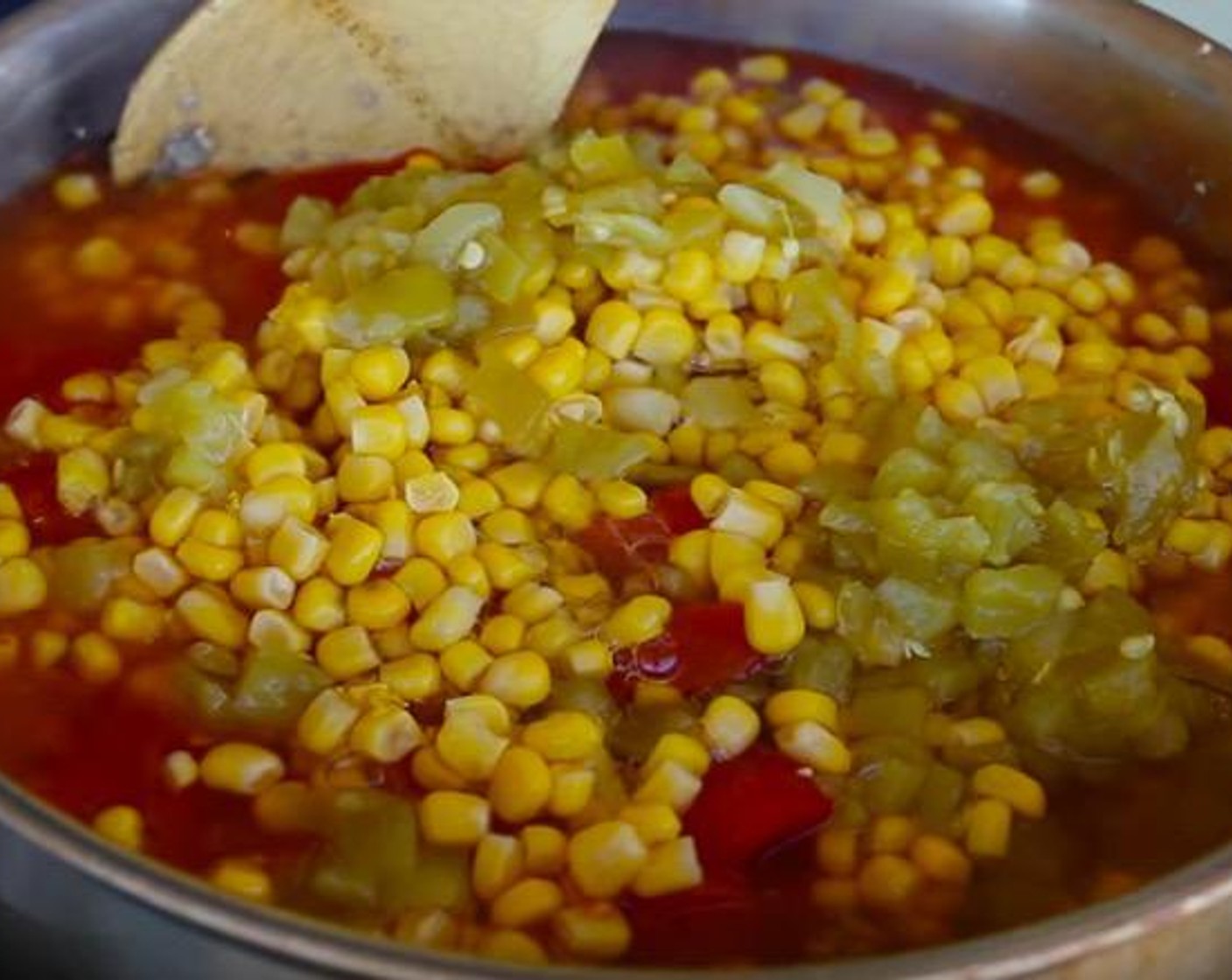 step 2 Add McCormick® Taco Seasoning Mix (1 pckg), Tomato Sauce (1 can), Diced Tomatoes (1 can), Sweet Corn (1 can), Mild Diced Green Chiles (1 can), and Beef Broth (2 cups). Mix everything together and bring to a boil.