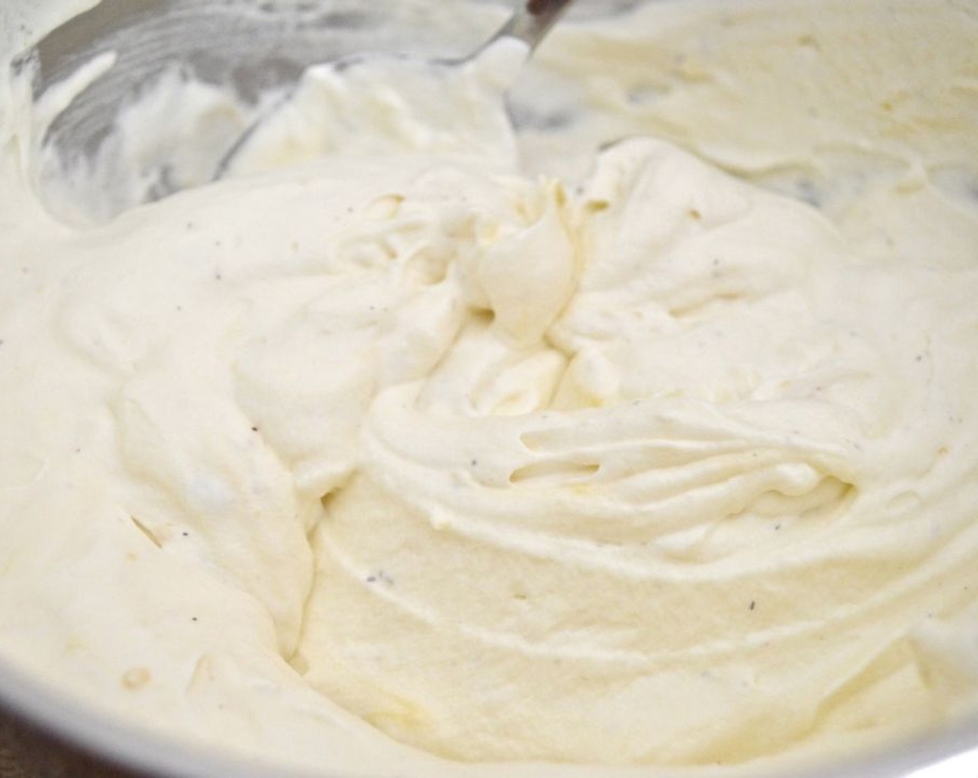 step 9 Whip up the Heavy Cream (1 cup) in a bowl with a hand mixer until it keeps stiff peaks. Stir in the Lemon Curd (3 Tbsp), Zest of the Lemon (1/2), and Ground Lavender (1/2 tsp).