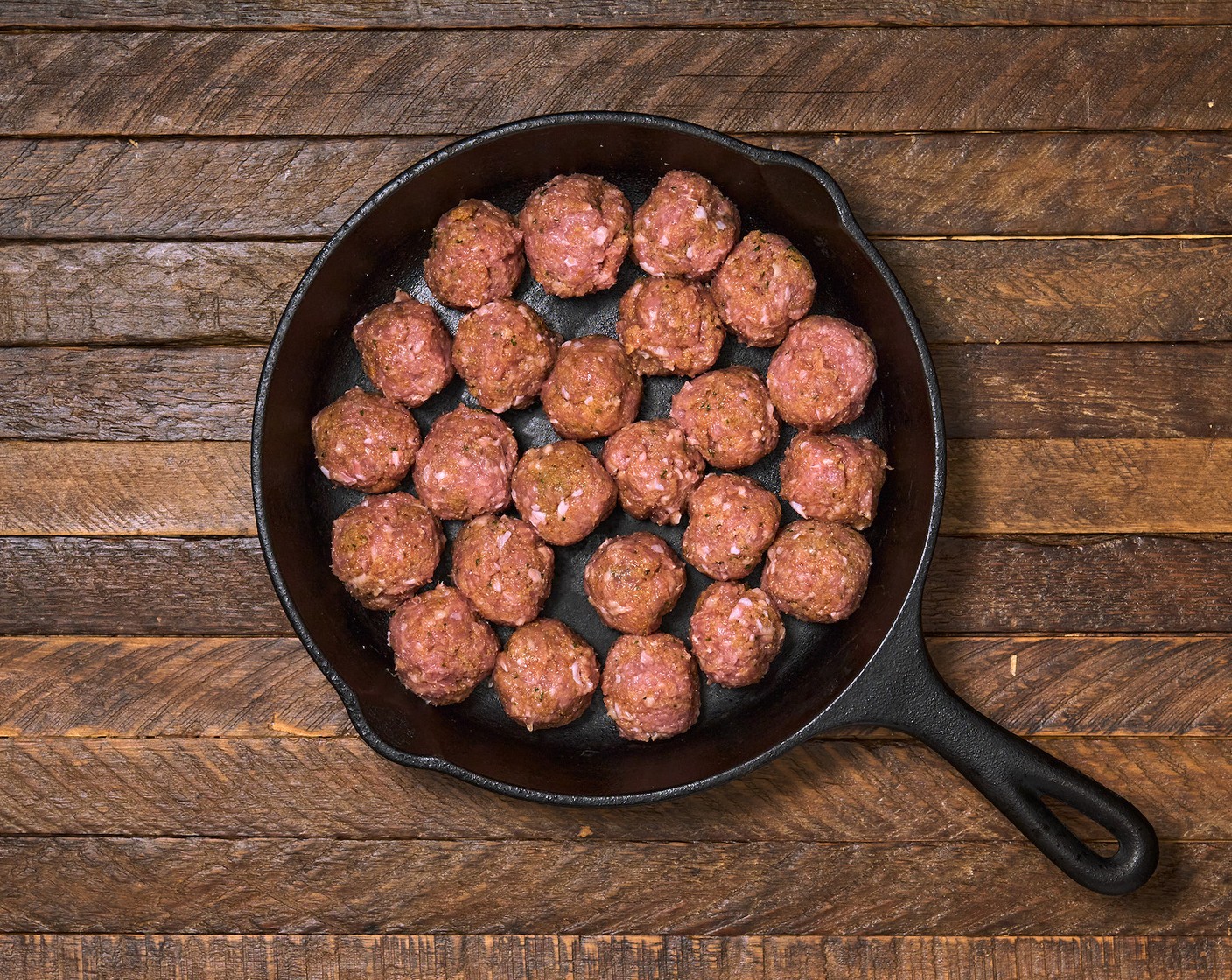 step 3 Arrange the meatballs in one layer in a pan with Olive Oil (as needed). Sear them on one side for 5 minutes. Turn off the heat and flip the meatballs.