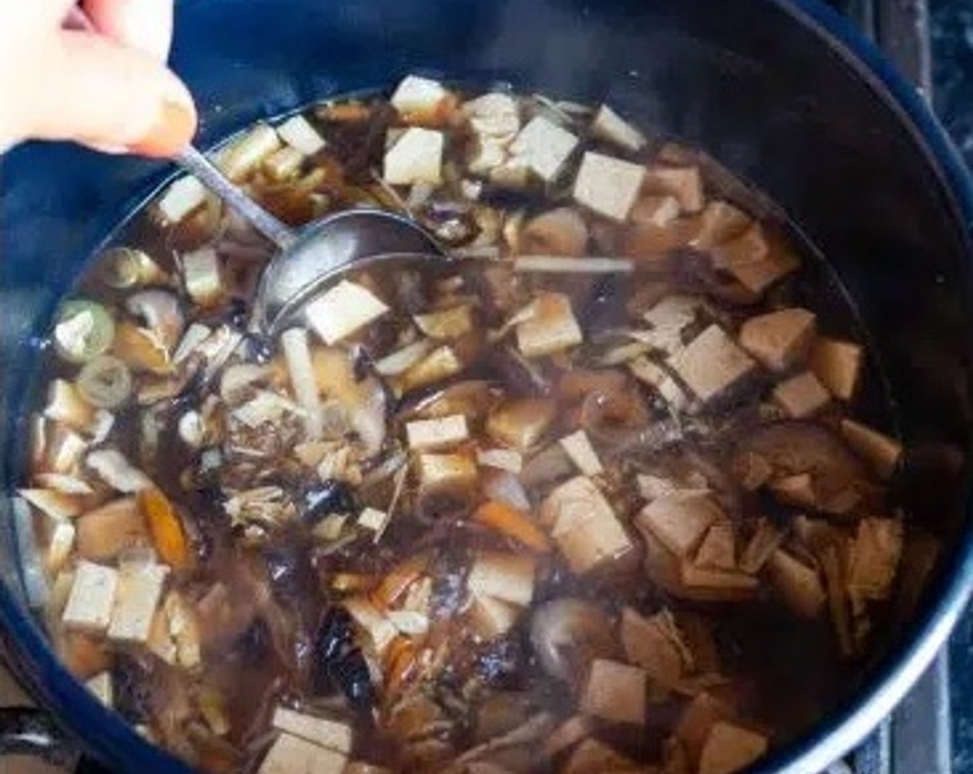 step 5 Season the soup with Chili Bean Sauce (1 Tbsp), Distilled White Vinegar (1 1/2 Tbsp), Granulated Sugar (1/4 tsp), Light Soy Sauce (2 Tbsp), Dark Soy Sauce (1 Tbsp) Salt (to taste), and Ground White Pepper (1 pinch). Close the lid and simmer for another 5 minutes.