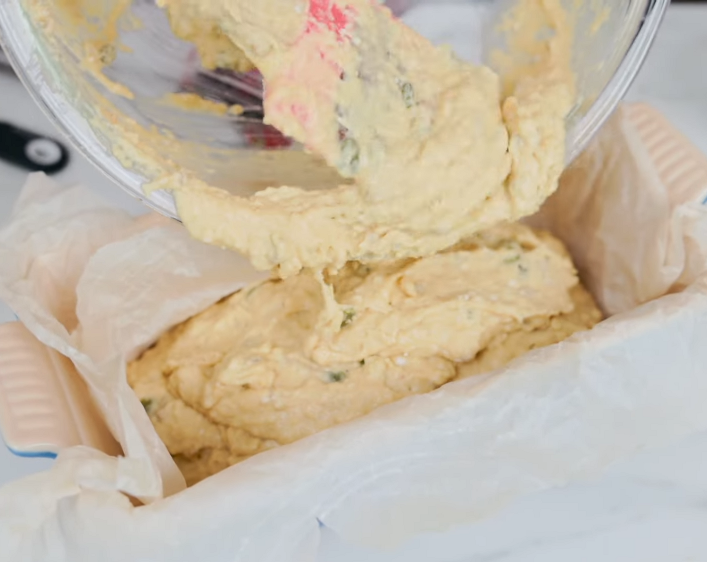 step 5 Pour the mixture into a parchment paper-lined standard-size loaf pan. Sprinkle top with additional seeds if you like. Bake for 45-50 minutes until a fork inserted comes out clean.