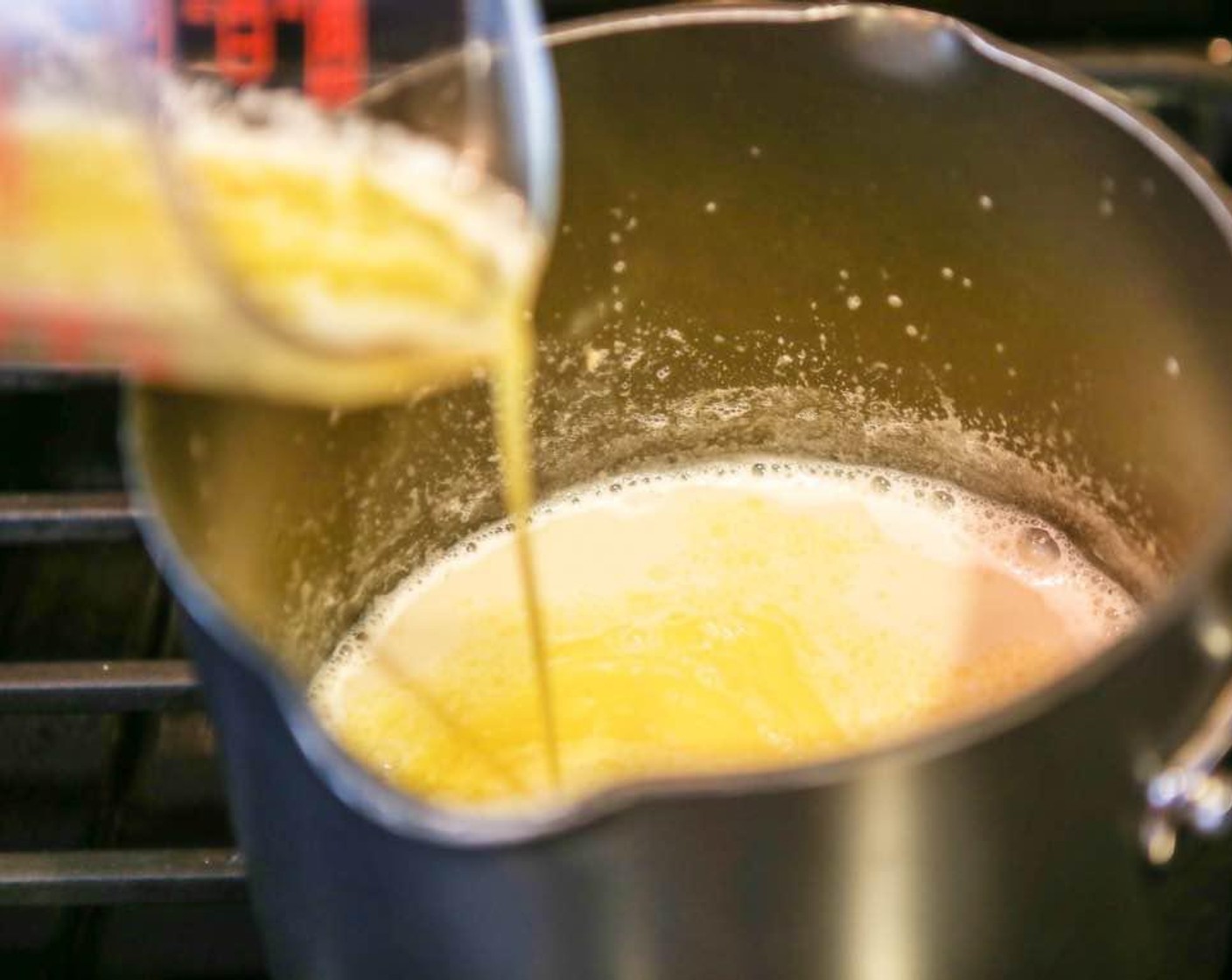 step 4 Whisk together the 1 Tbsp of water and the Corn Starch (3 Tbsp), then add to the saucepan while continuing to stir. The mixture should start thickening. When it sticks to the back of the spoon remove from heat. Remove the vanilla bean.