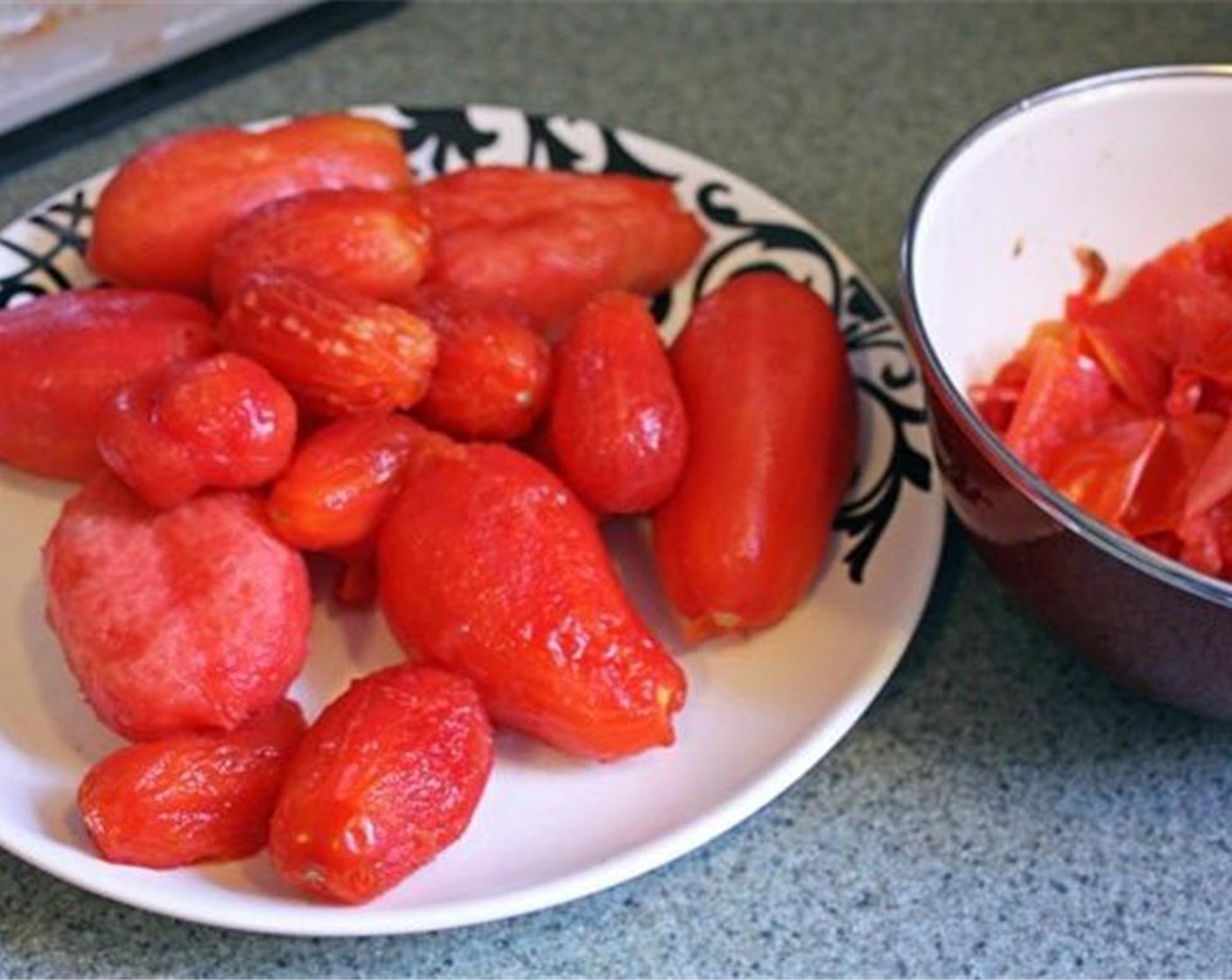 step 5 Peel off all the skin from each of the tomatoes and discard.
