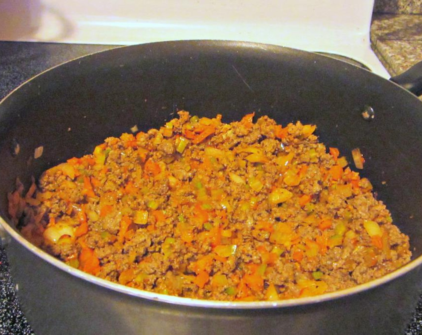 step 3 When the beef is almost fully cooked, add Salt (1 tsp), Ground Black Pepper (1/2 tsp), and Dried Oregano (1/2 Tbsp), to the ground meat. Once browned, drain any excess fat from the beef and set aside.
