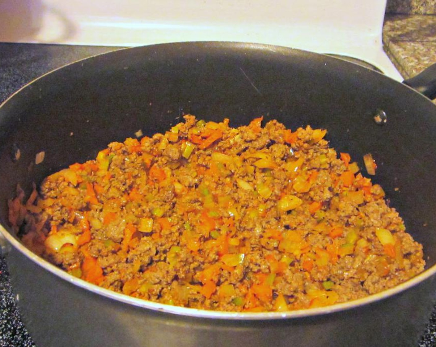 step 3 When the beef is almost fully cooked, add Salt (1 tsp), Ground Black Pepper (1/2 tsp), and Dried Oregano (2 tsp), to the ground meat. Once browned, drain any excess fat from the beef and set aside.