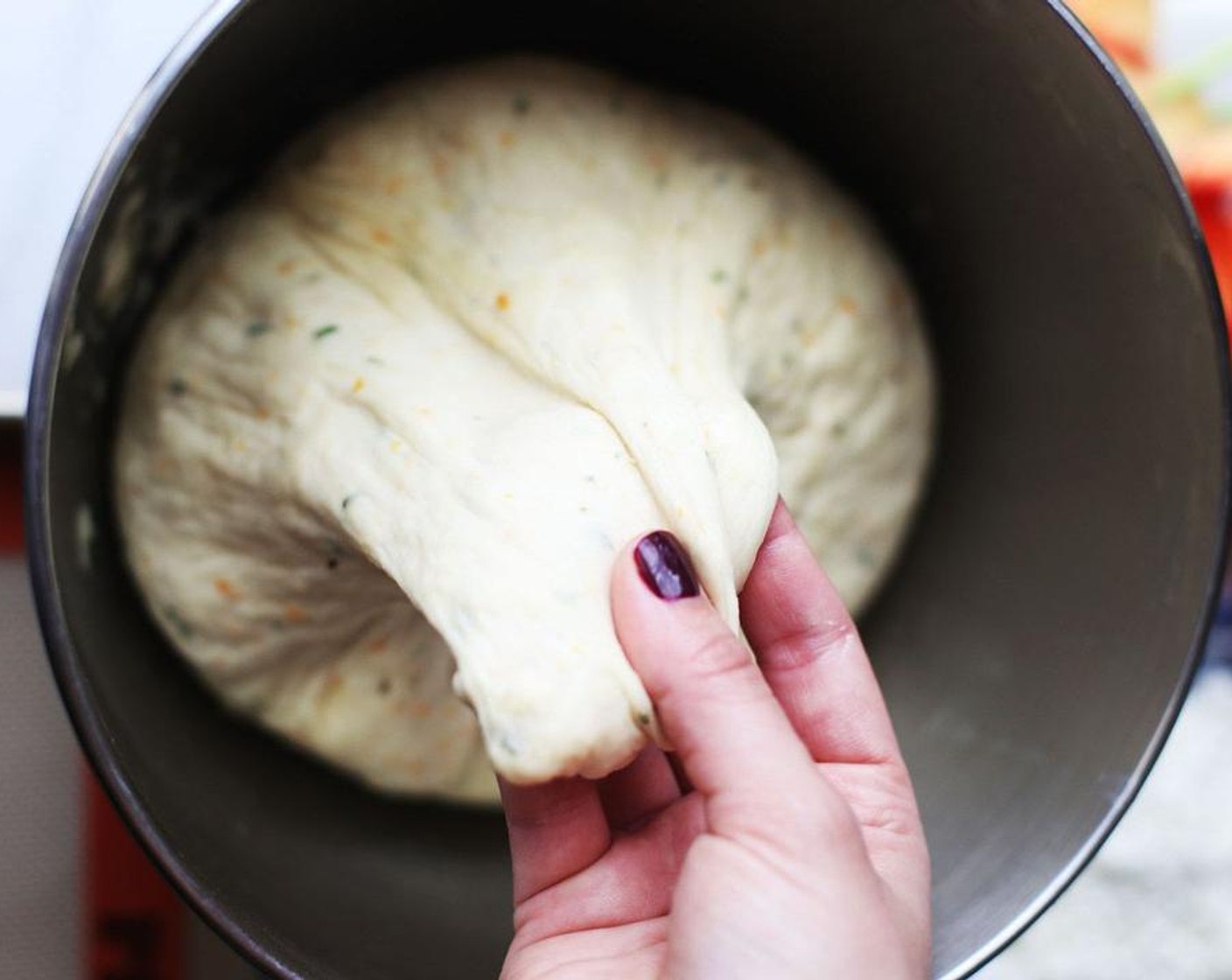 step 5 Place some olive oil in the previously-used bowl and roll the dough in it, and cover with a dry towel. Set dough aside to rise for about an hour or until it has doubled in size.