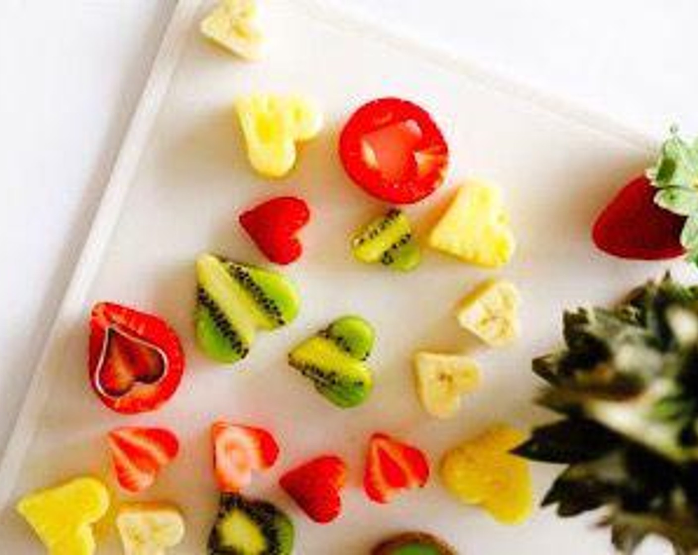 step 1 Slice the Fresh Strawberry (1 cup), Banana (1 cup), and Pineapple (1 cup) into 1/2-inch thick slabs then use a heart-shaped cookie cutter to cut into shapes. Alternatively, use a small melon baller to create ball shapes.