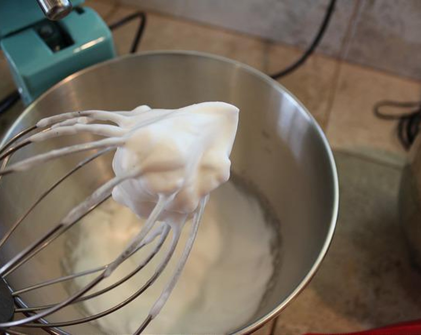 step 3 Whisk on high until stiff peaks form. On my mixer, soft peaks happen around 2-3 minutes & stiff peaks around 4-5 minutes. Once you have stiff peaks, use a spatula to scoop out the fluff and set-aside.