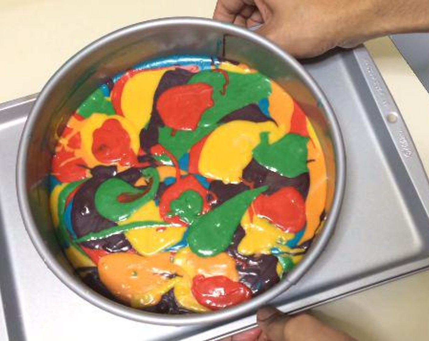 step 5 Spoon the batter into your prepared pan, scatter each color on top of each other. Bake for 70 minutes or until a tooth pick inserted to the middle comes out clean.