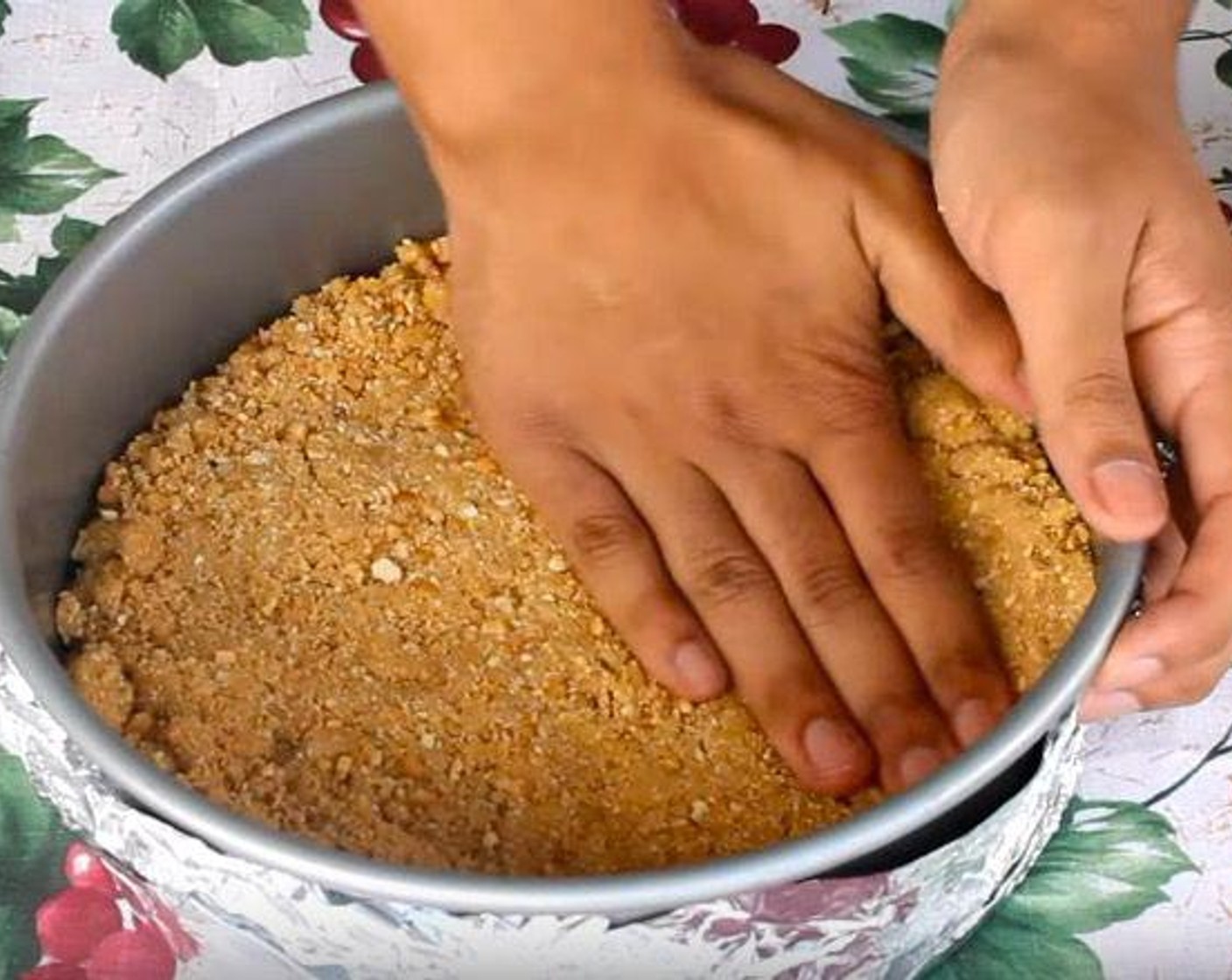 step 2 In a Ziploc bag, add Graham Cracker Crumbs (2 cups), Granulated Sugar (1/4 cup) and Butter (1/2 cup). Shake together until mixture resembles wet sand. Transfer to a springform pan lined with aluminum foil and press down into the bottom of the dish. Store in fridge until ready to use.