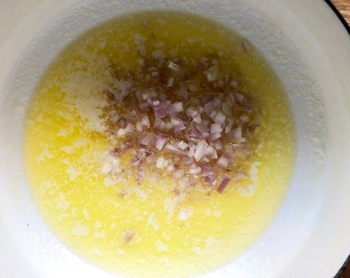 step 3 In a medium saucepan, melt the Salted Butter (3 Tbsp). Add the Shallots (1 1/2 Tbsp). Sauté for 5 minutes over medium heat until softened.