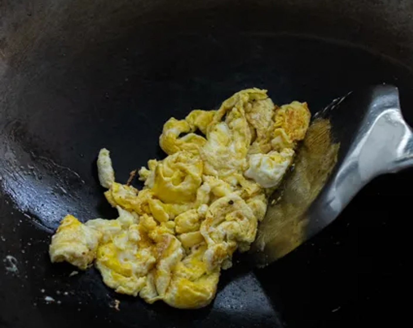 step 6 Add more oil to the wok if it's dry, then scramble the Eggs (2).