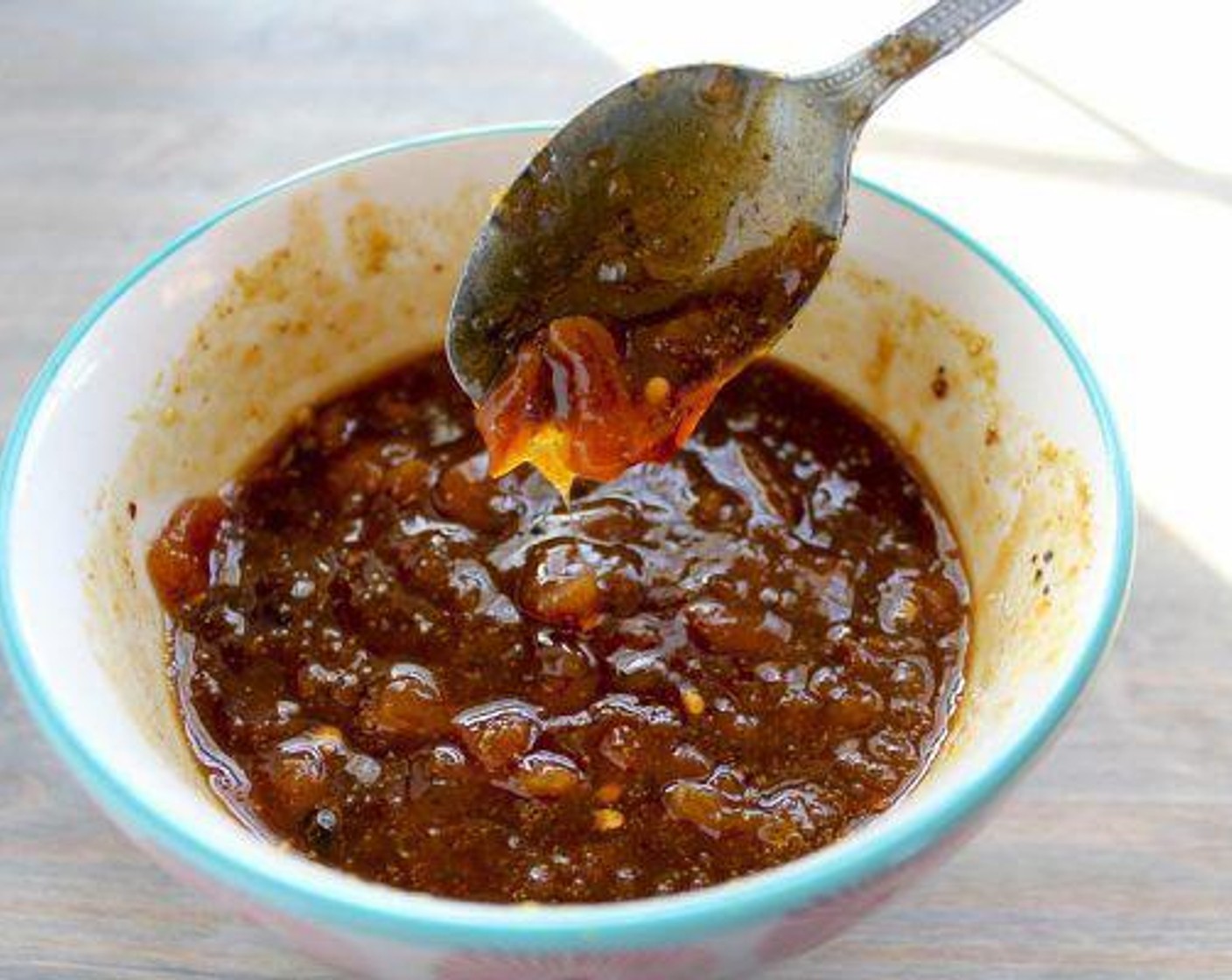 step 2 In a medium bowl, combine the Apricot Preserves (3/4 cup), Dried Apricot (1/2 cup), and Chicken Broth (1/4 cup). Stir in the Spicy Brown Mustard (2 Tbsp), Soy Sauce (2 Tbsp), zest from Lemon (1/4), Crushed Red Pepper Flakes (1/2 tsp), Salt (1/4 tsp), Ground Black Pepper (1/2 tsp), and McCormick® Garlic Powder (1/4 tsp). Let this rest at room temperature while the grill is heating.