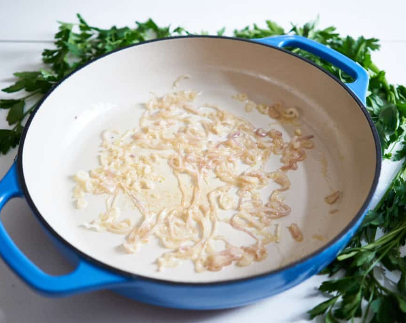 step 4 Place stockpot or wide skillet over medium heat. Add Butter (2 Tbsp) to the pot. Once melted, add Shallots (2) and sauté until soft and just beginning to brown.