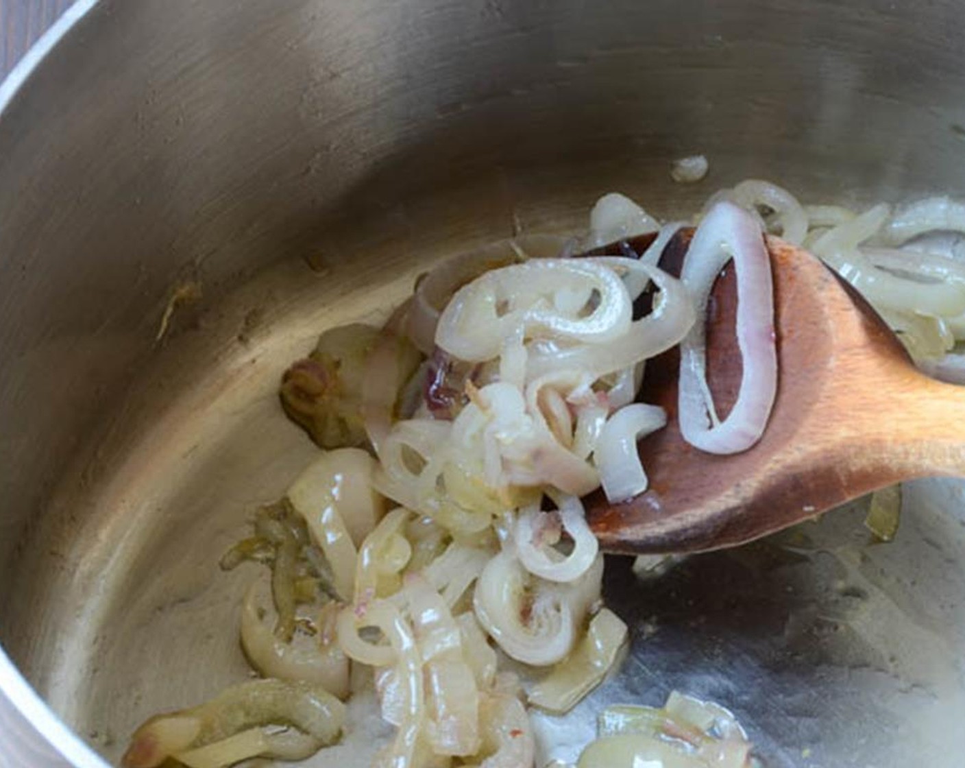 step 3 In a large saucepan, heat the Olive Oil (2 Tbsp) over medium heat and add the Shallots (2) that have been peeled and sliced, and 1/4 teaspoon of the Kosher Salt (1/4 tsp). Cook until the shallots soften and become translucent.