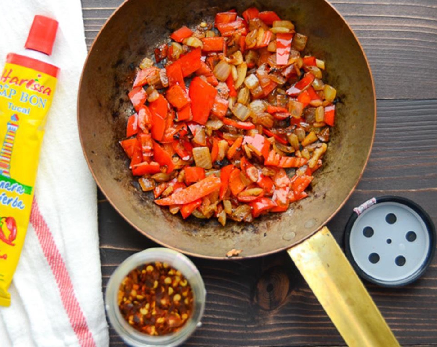 step 5 Heat the Olive Oil (1/2 tsp) in a frying pan over medium heat and add the onion, garlic and fresh chilies. Cook 6 to 8 minutes until fragrant and slightly browned.