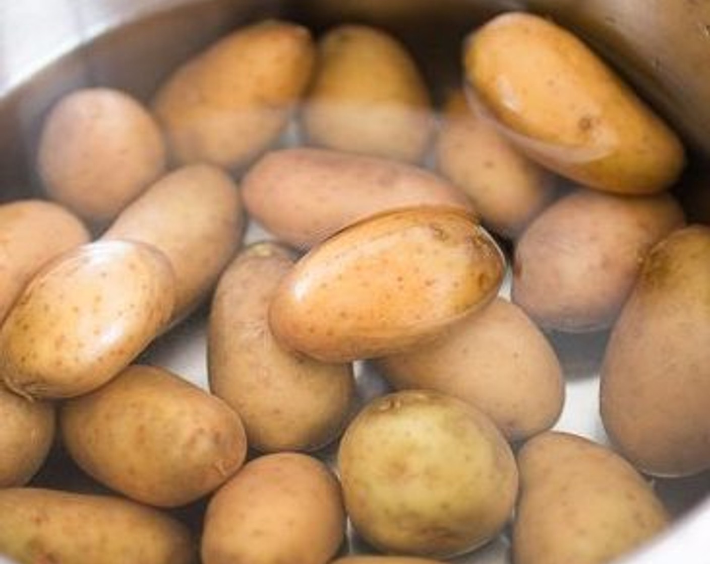 step 1 Wash and place the Baby Potatoes (1.7 lb) in a pan. Cover with at least 3cm of boiling water and cook on medium heat until tender for about 20 minutes.