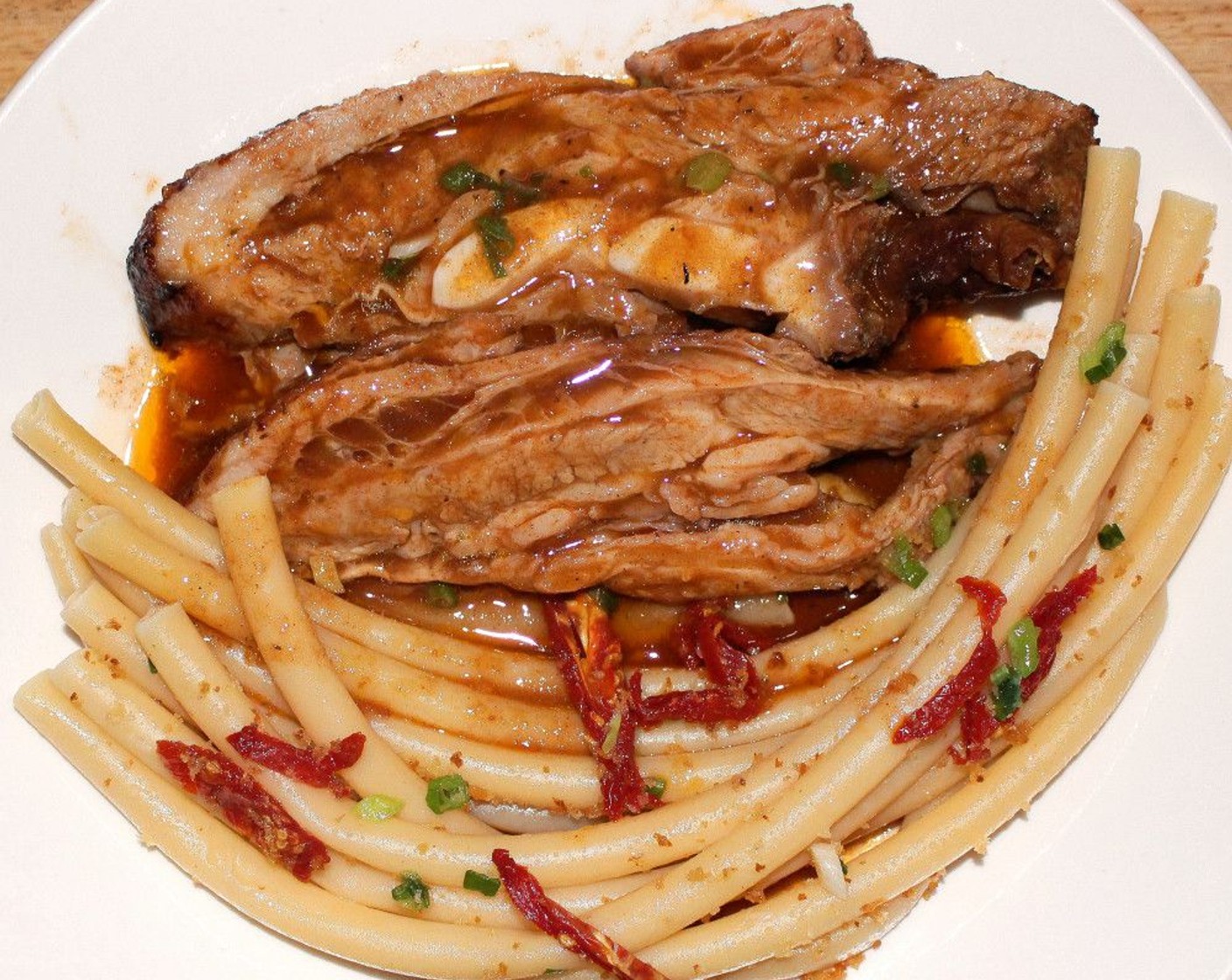 step 11 Arrange the veal and pasta on serving platters, cover veal with sauce.
