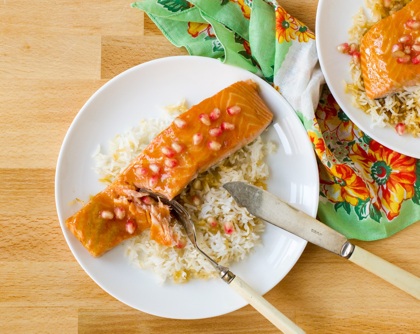 step 6 Divide the rice and salmon among four plates. Garnish each plate with Pomegranate Seeds (1/2 cup). Serve immediately.