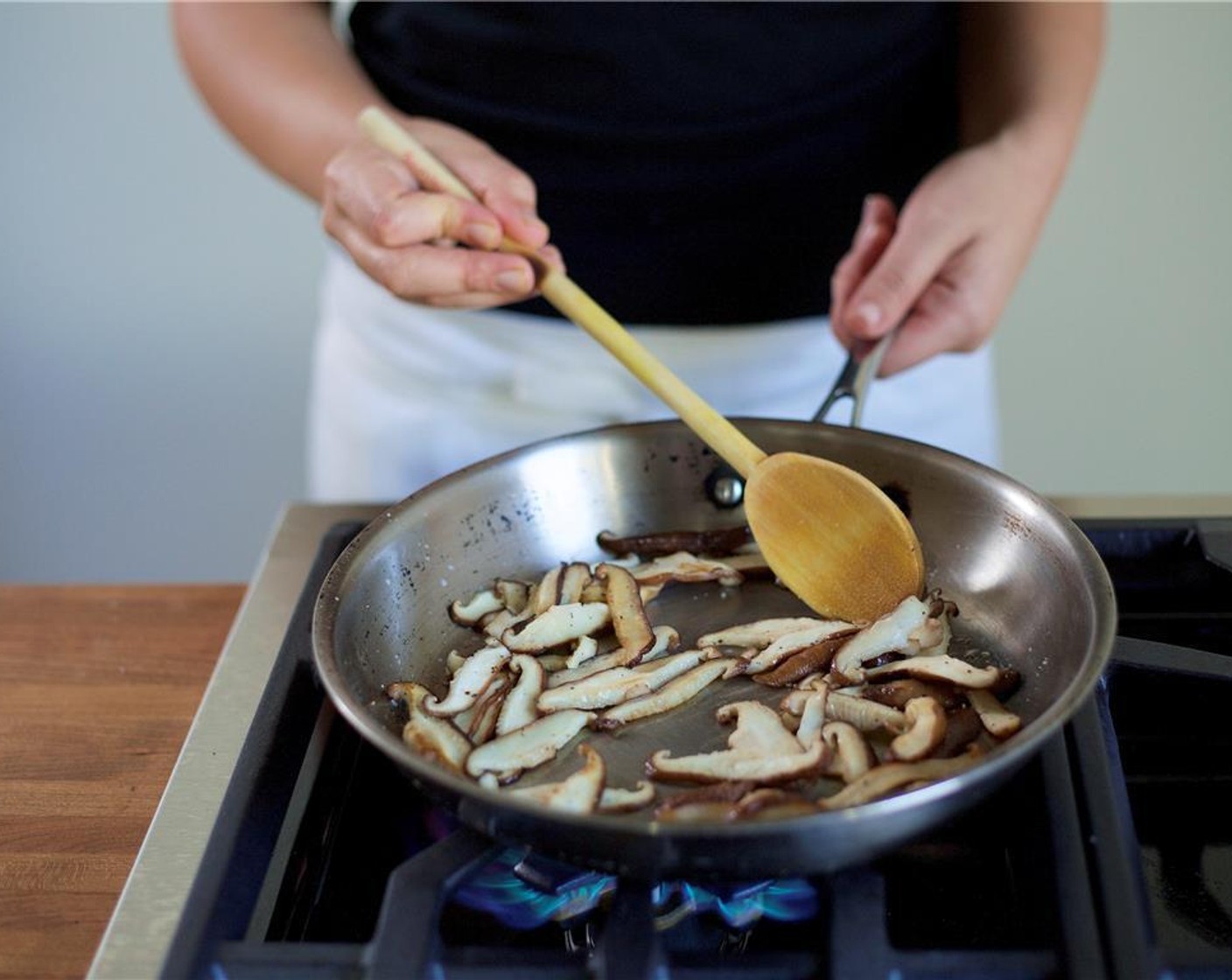 step 6 Heat a large saute pan over high heat with Vegetable Oil (1 Tbsp). Add the mushrooms along with Salt (1/4 tsp) and Ground Black Pepper (1/4 tsp). Saute for three minutes. Remove and keep warm.