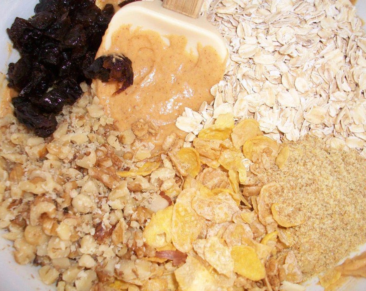 step 4 After combined, mix in the dry ingredients, then add Oats (1/2 cup), Honey Bunches of Oats® Honey Roasted (1/2 cup), Sun-Maid Raisins (1/3 cup), Walnut (1/3 cup), and Flaxseeds (1 Tbsp).