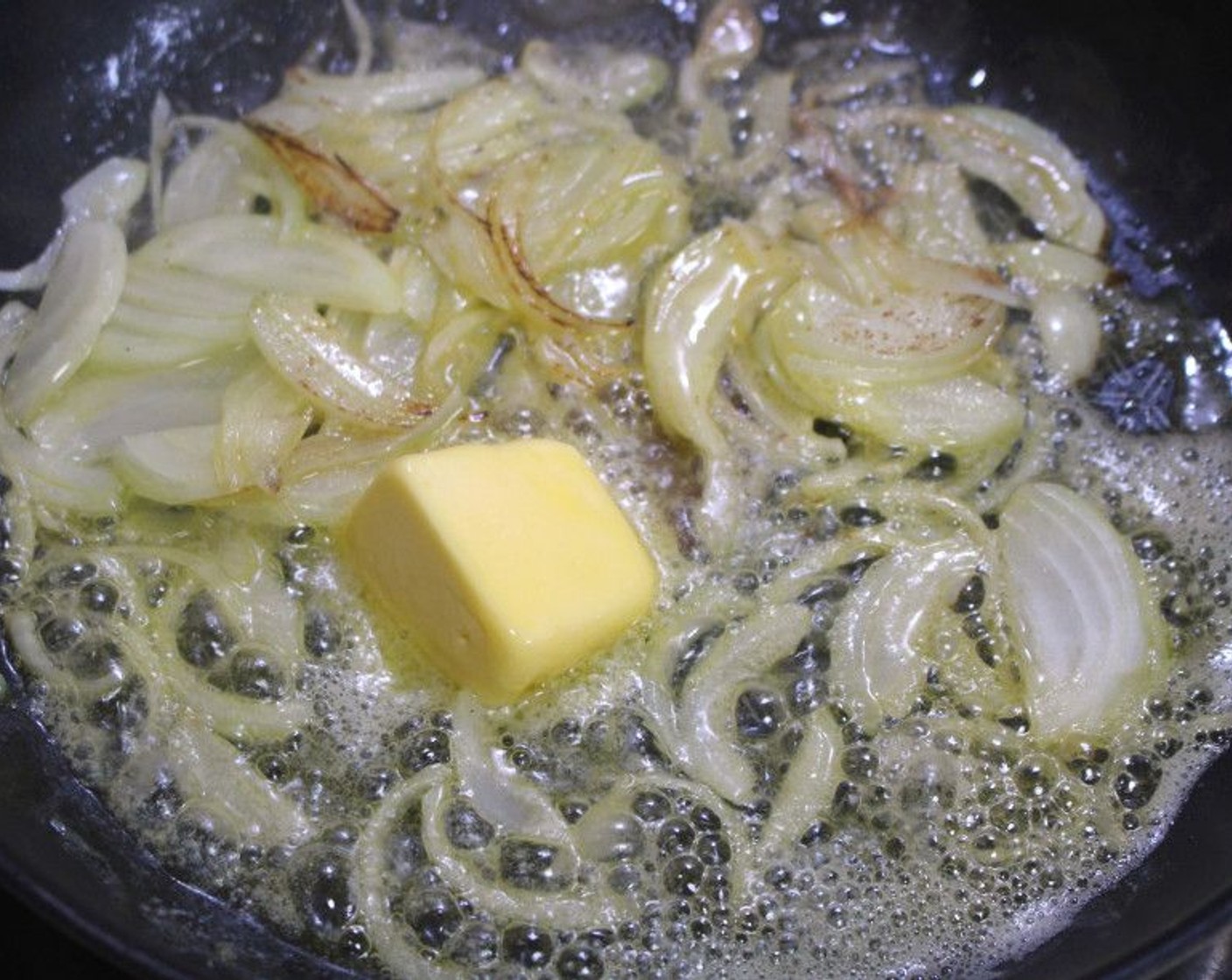 step 8 In a pan, saute the Onion (1) in Butter (4 oz).