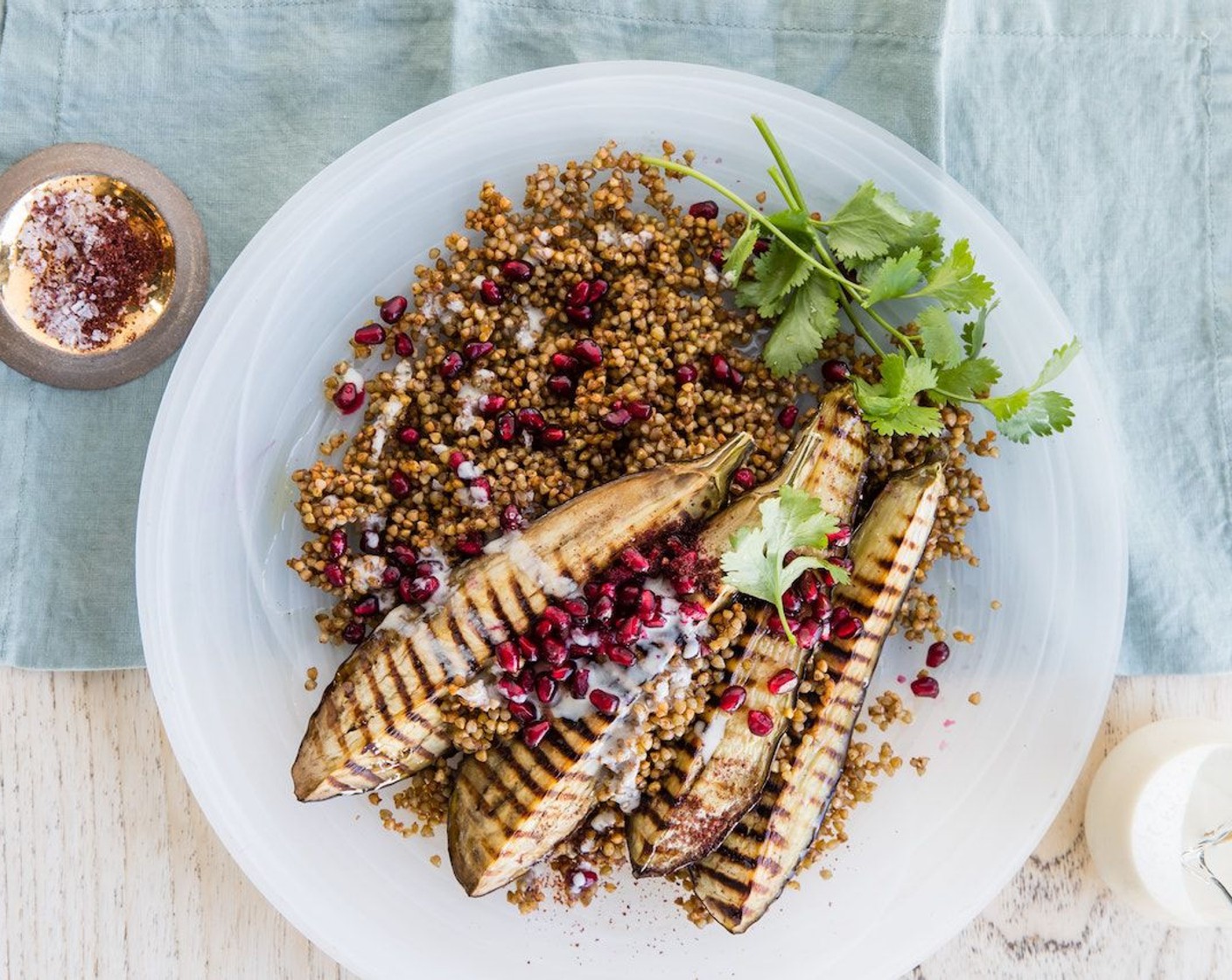 step 13 Garnish the dish with Pomegranate (1), Fresh Cilantro (1/2 cup) and Ground Sumac (1 Tbsp).